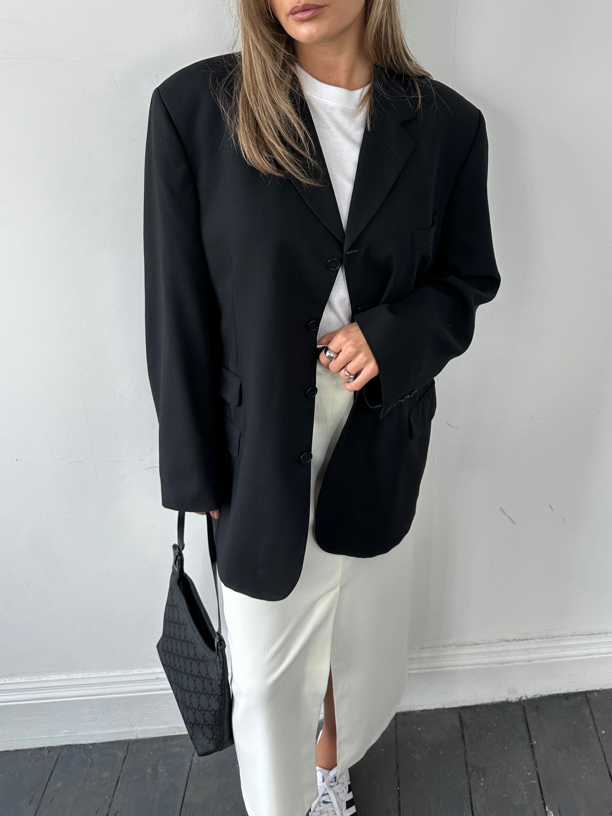 Vintage pure wool tailored single-breasted blazer in size 46/XL, shown on a hanger with classic lapel and structured fit.