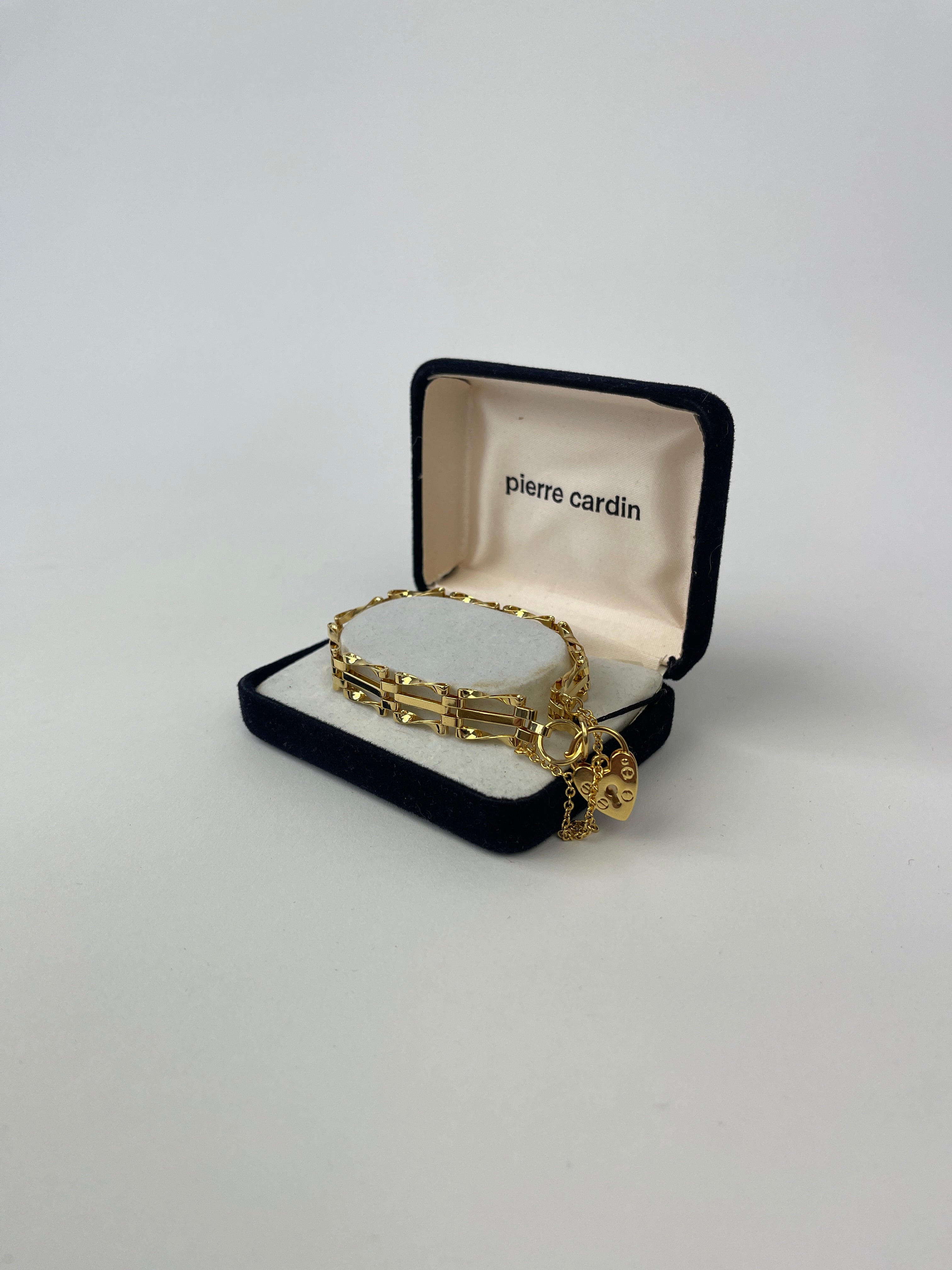 Pierre Cardin gold plated bracelet with sleek, stylish design showcasing polished metal links and subtle branding.