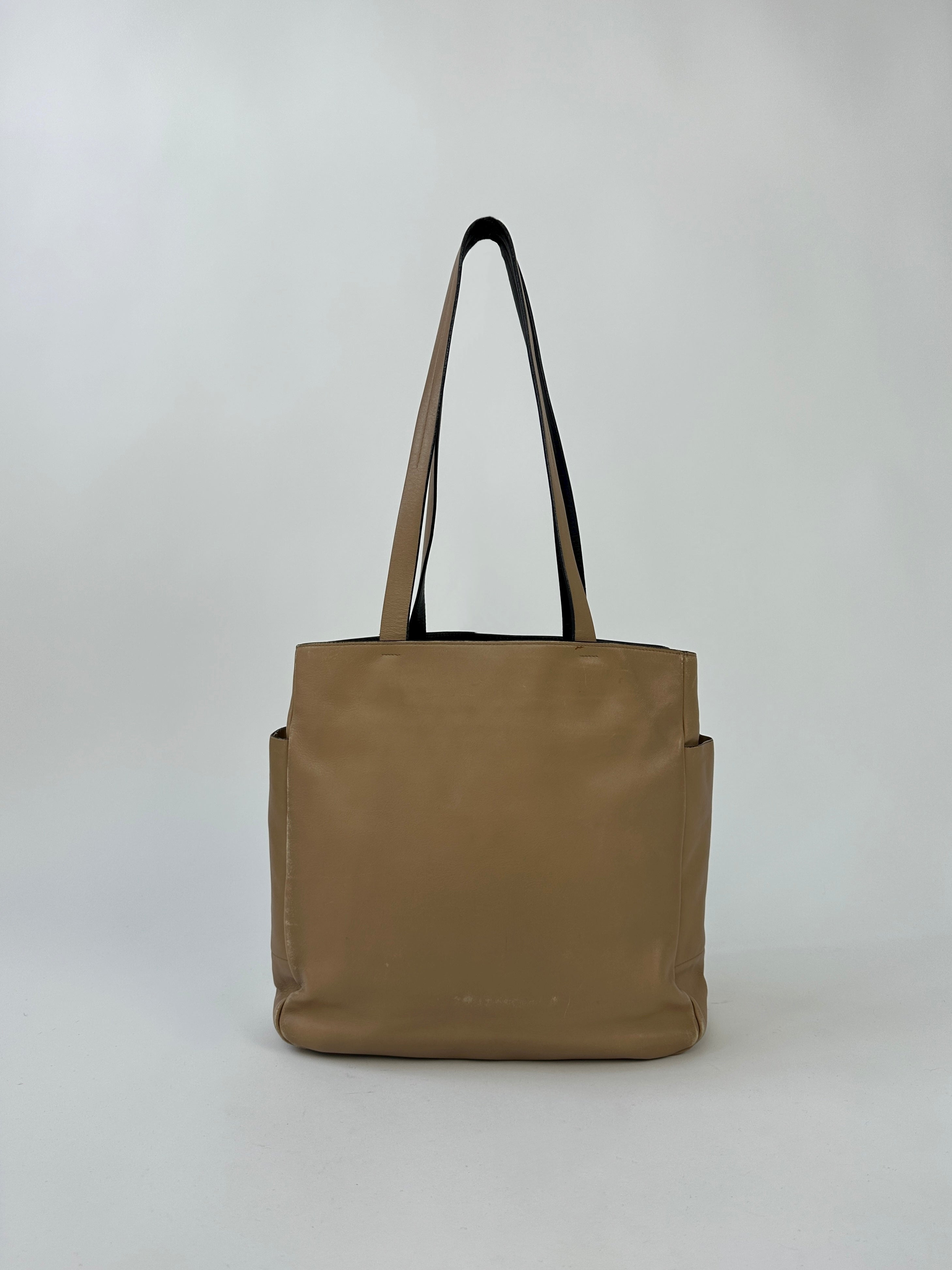 Prada Contrast Leather Tote Bag with sleek design, featuring smooth leather and contrasting accents, perfect for stylish everyday use.