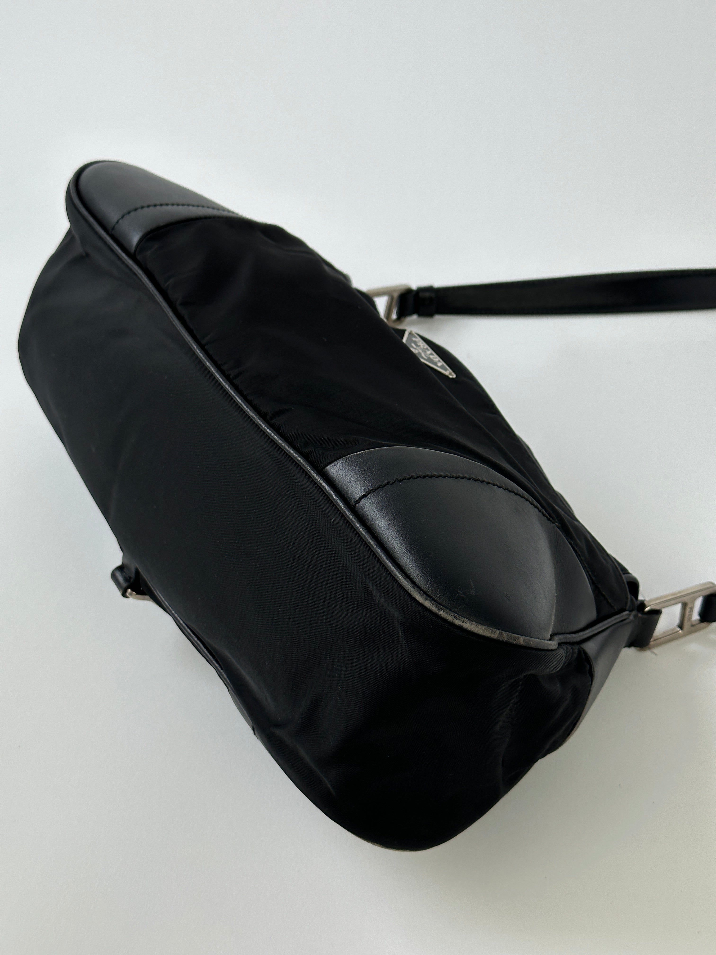 Prada 2000s Tessuto nylon double-sided shoulder bag with adjustable strap and sleek design, perfect for everyday use.