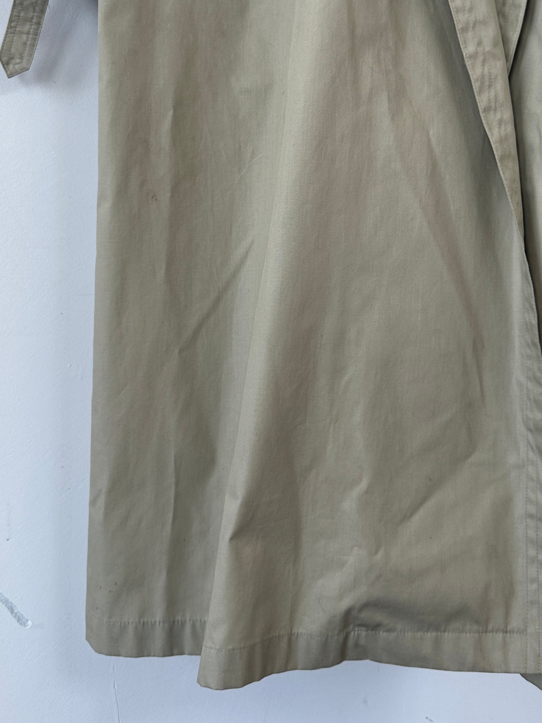 Yves Saint Laurent double-breasted trench coat in size L/XL, beige fabric with classic collar and button details.