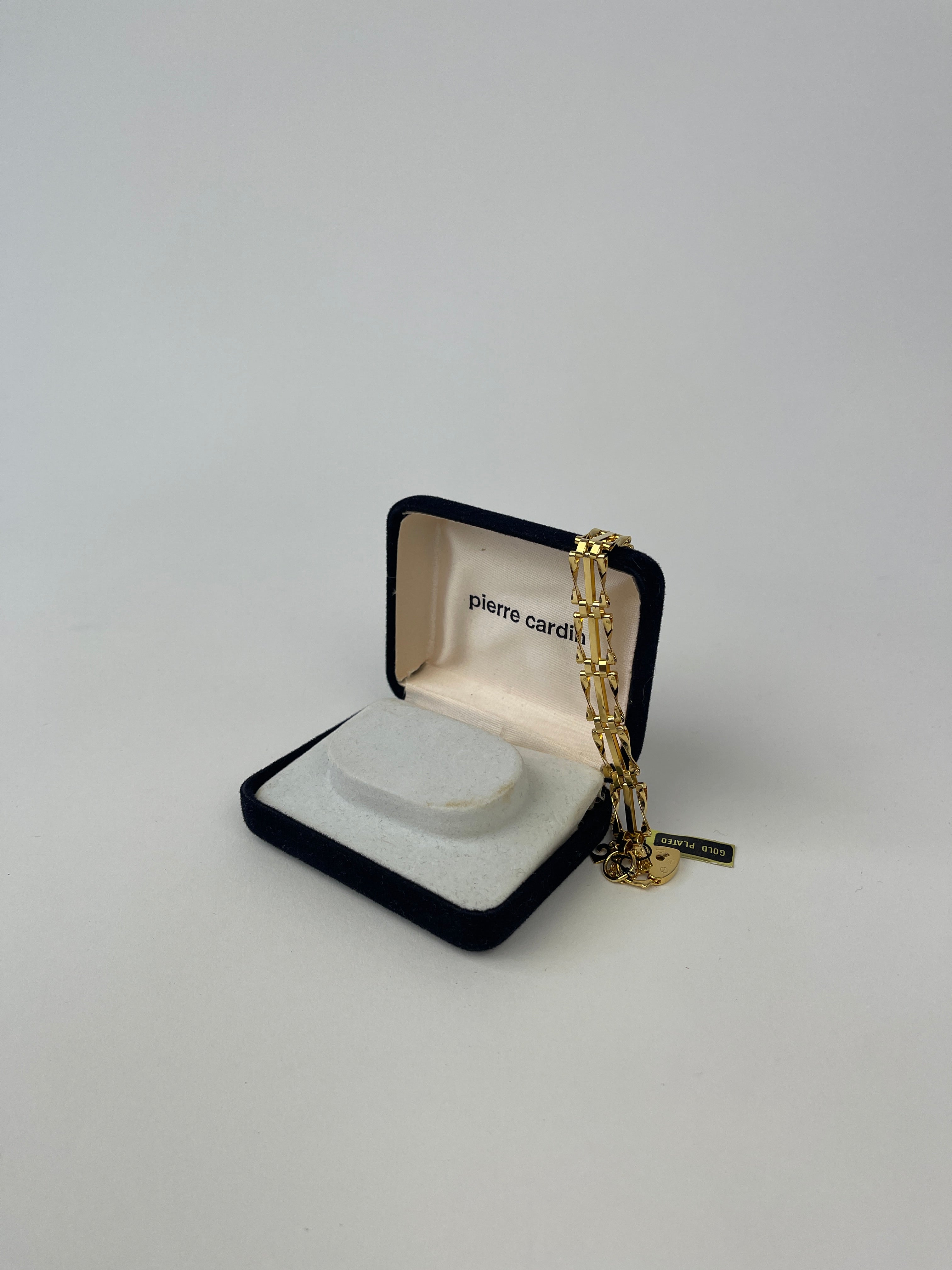 Pierre Cardin gold plated bracelet with sleek design and adjustable chain, showcasing a stylish accessory for elegant occasions.