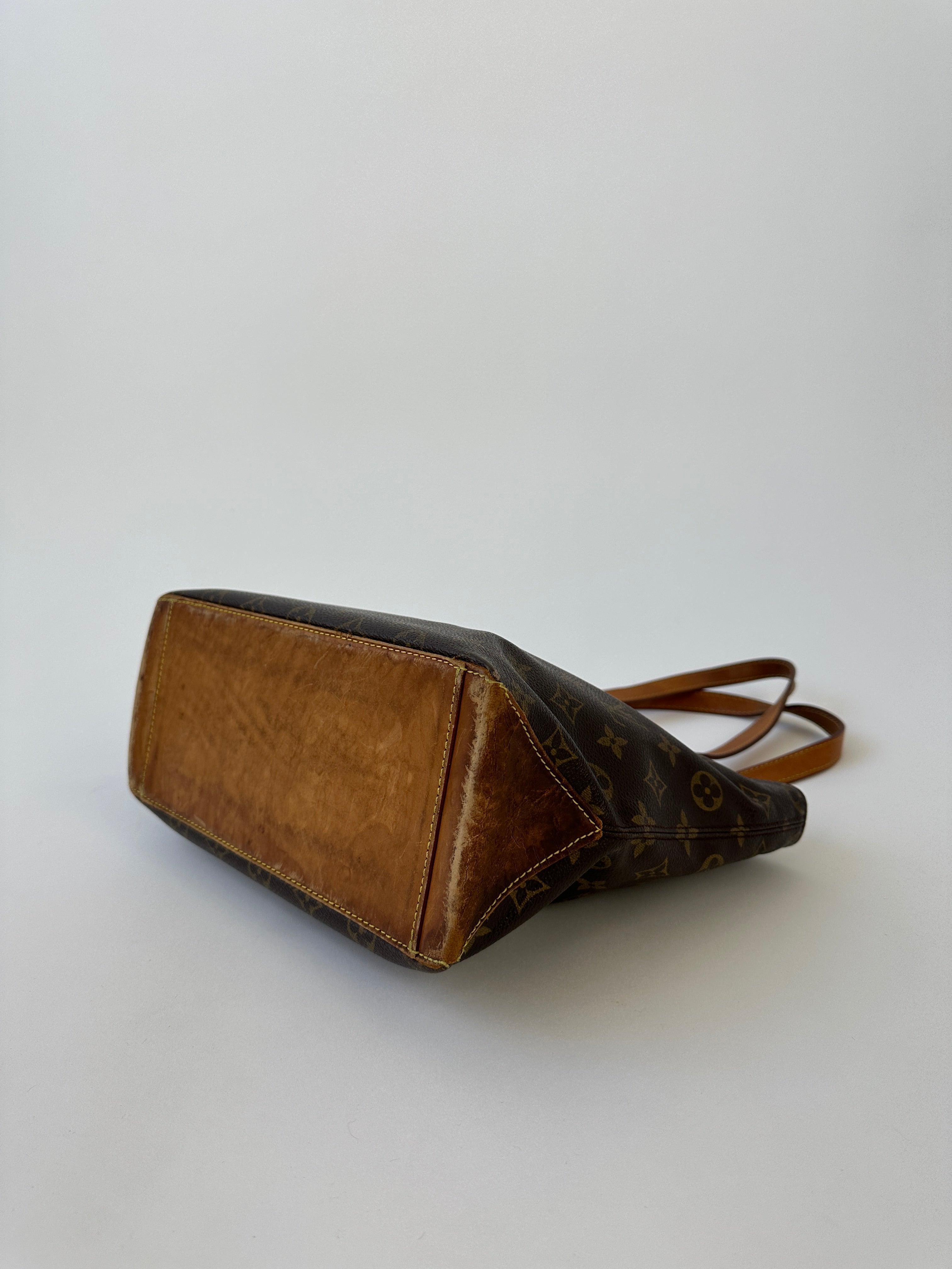 Louis Vuitton 2002 Cabas Mezzo Monogram shoulder bag with leather handles and signature monogram canvas.