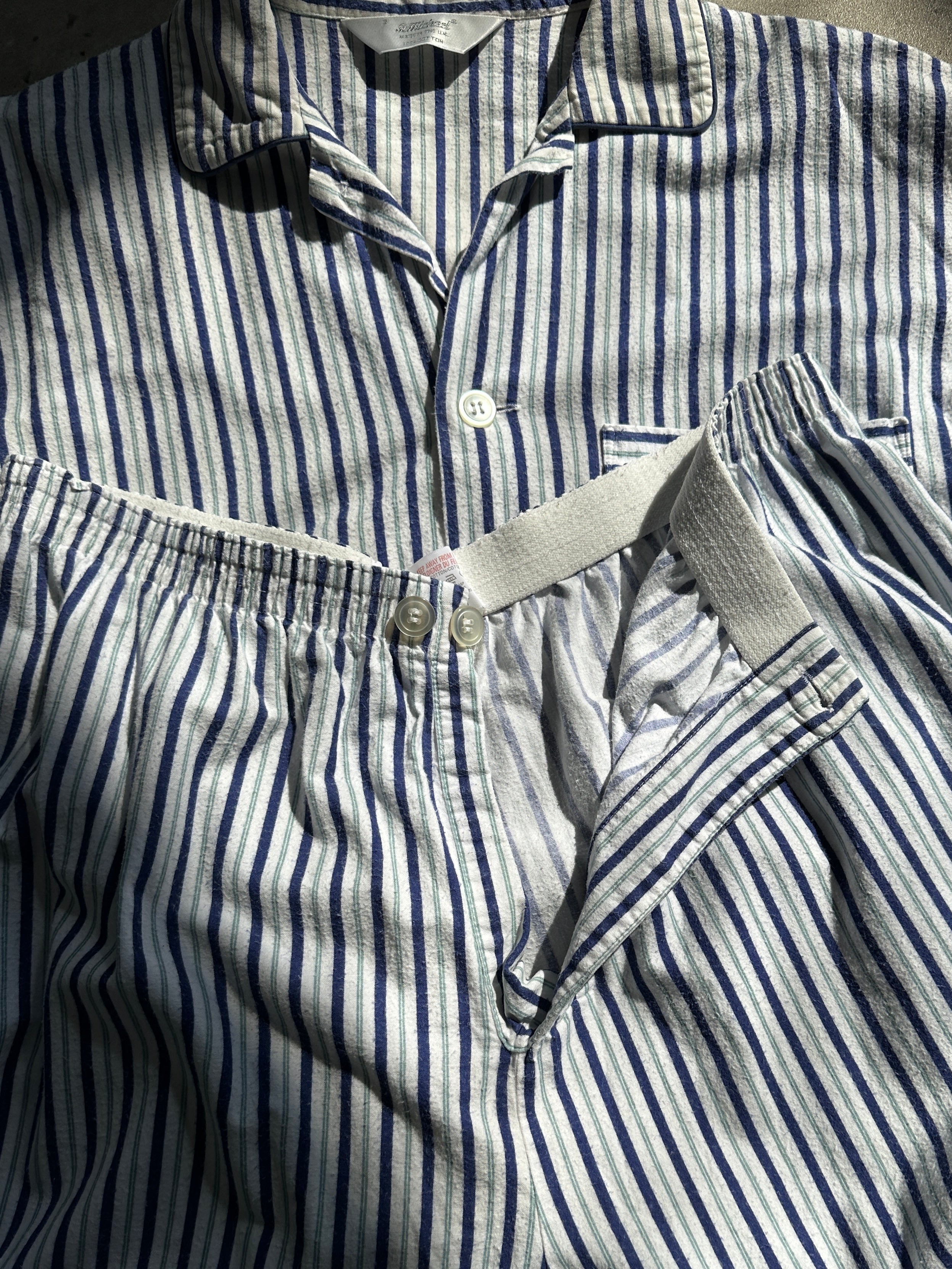 St Michael brushed cotton stripe two-piece pyjama set with long sleeves and pants, in blue and white.
