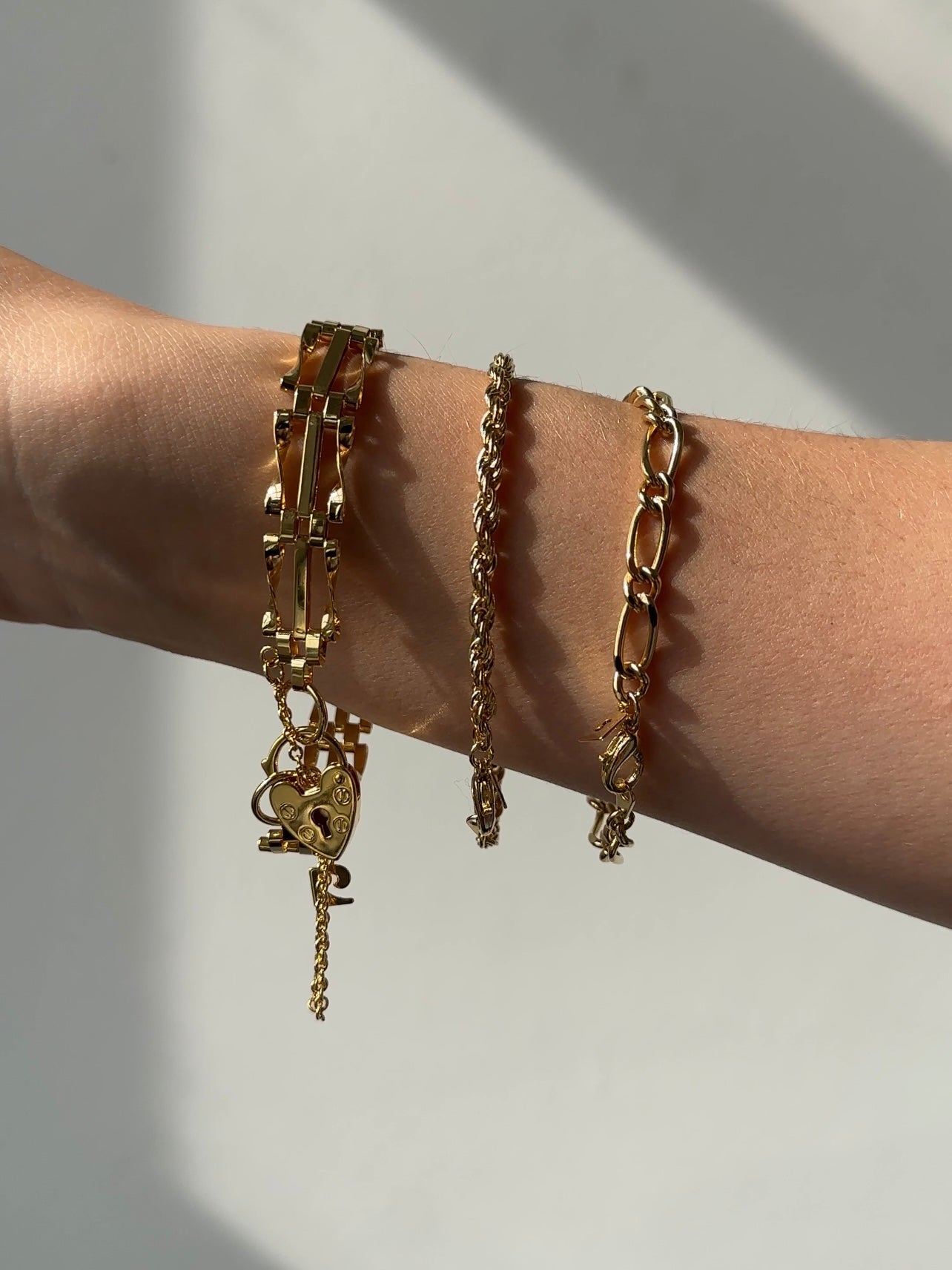 Pierre Cardin gold plated bracelet with sleek linked design, showcasing shiny metallic finish and elegant craftsmanship.