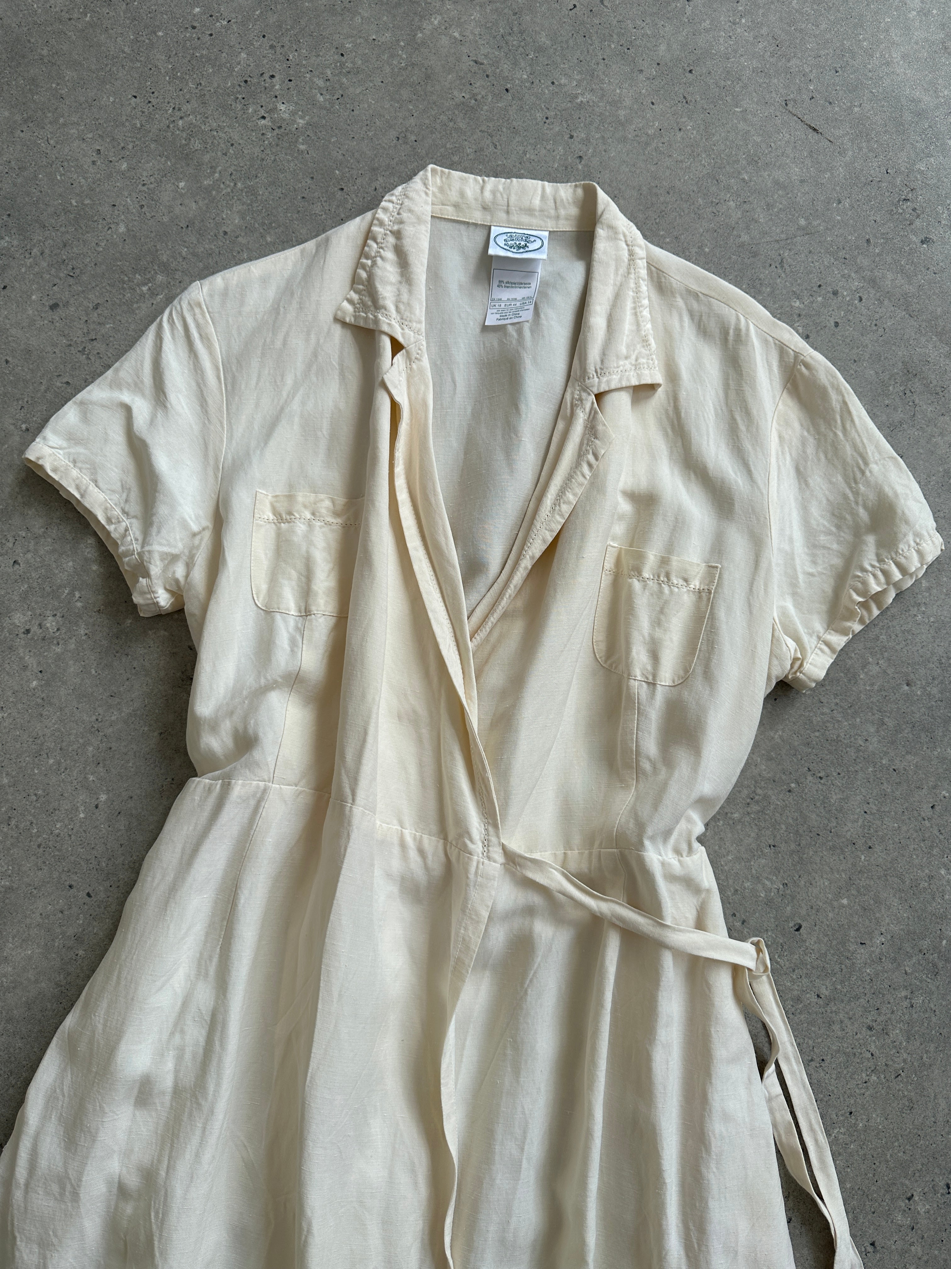 Laura Ashley silk linen maxi wrap dress in S/M, featuring a flowing design with long sleeves and a tie waist, elegant and lightweight.