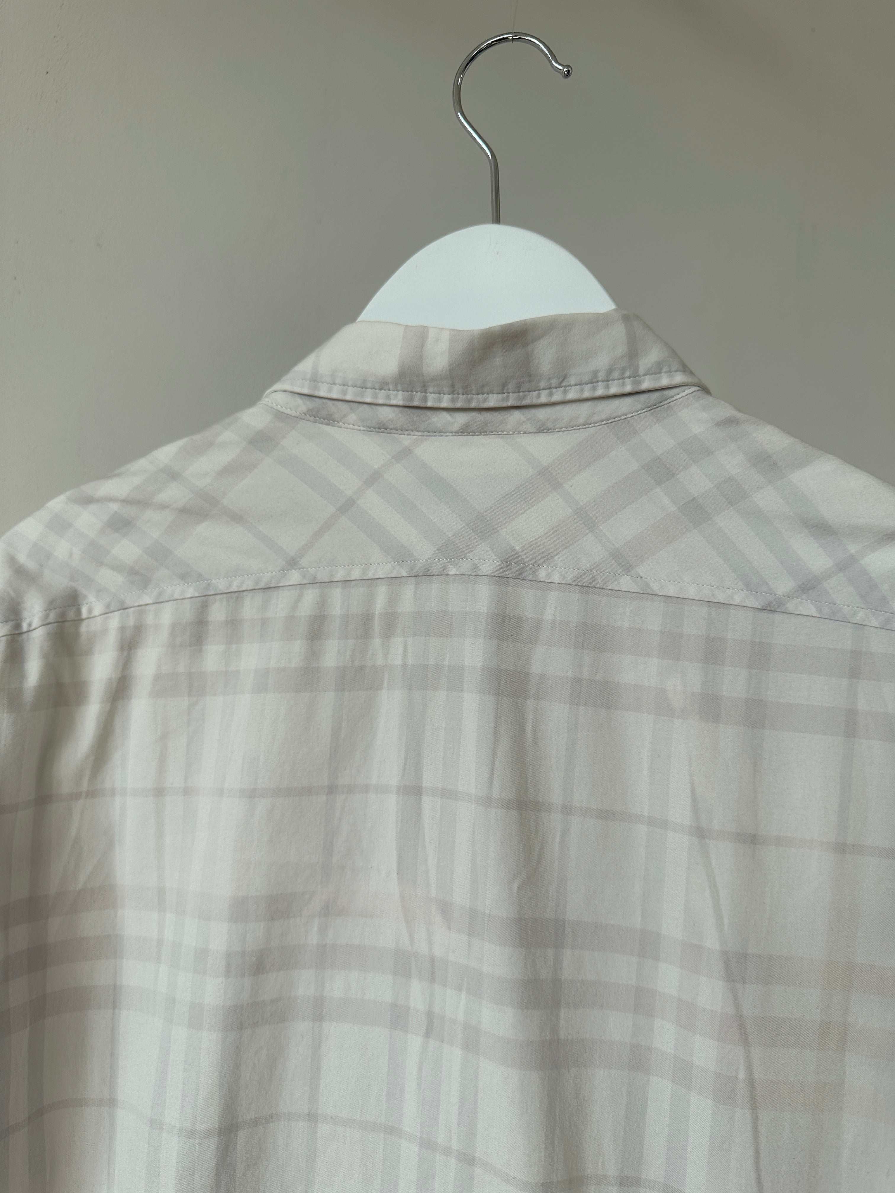 Burberry London Check cotton shirt in size S/M, featuring classic plaid pattern and button-down front, styled on a model.