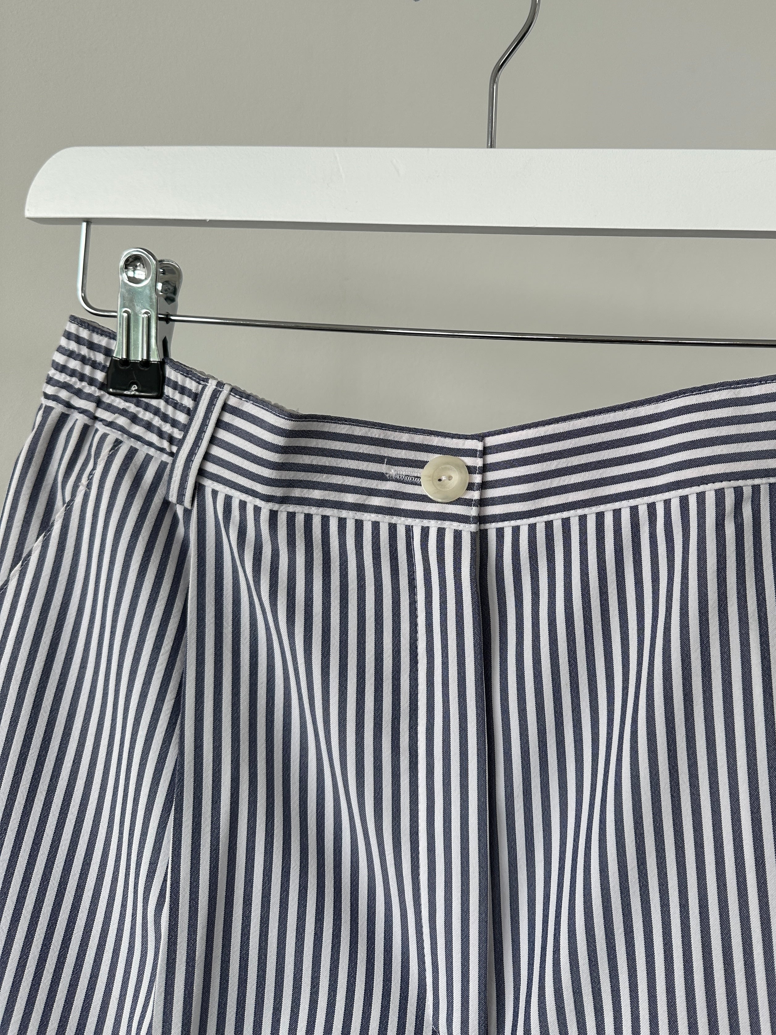 Vintage brand vintage stripe pleated shorts in size W28, showing the front view with a high waist and pleated fabric design.