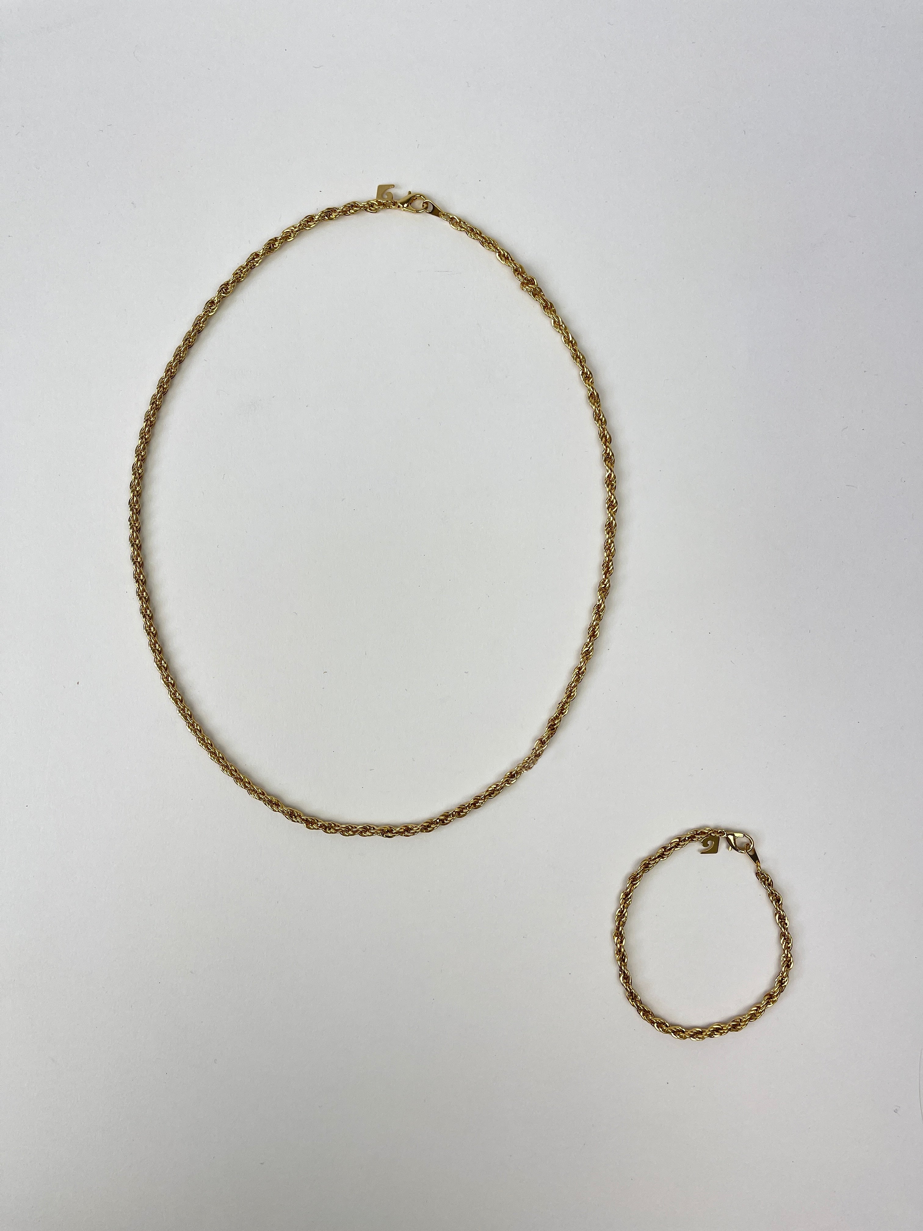 Pierre Cardin gold plated necklace and bracelet chain set with sleek, polished finish, featuring elegant links and classic design.
