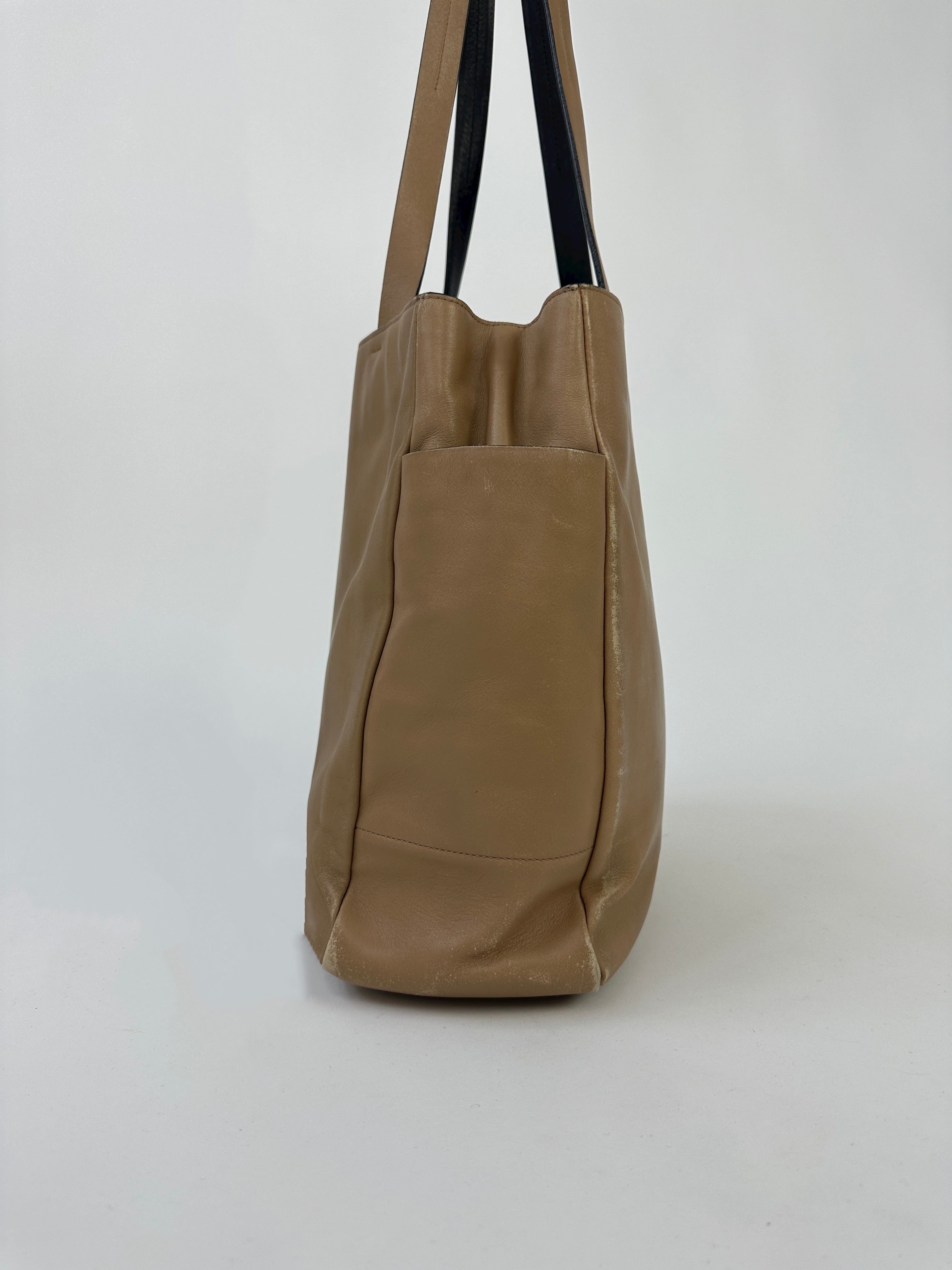 Prada contrast leather tote bag with sleek design, featuring dual handles and a spacious interior for everyday use.