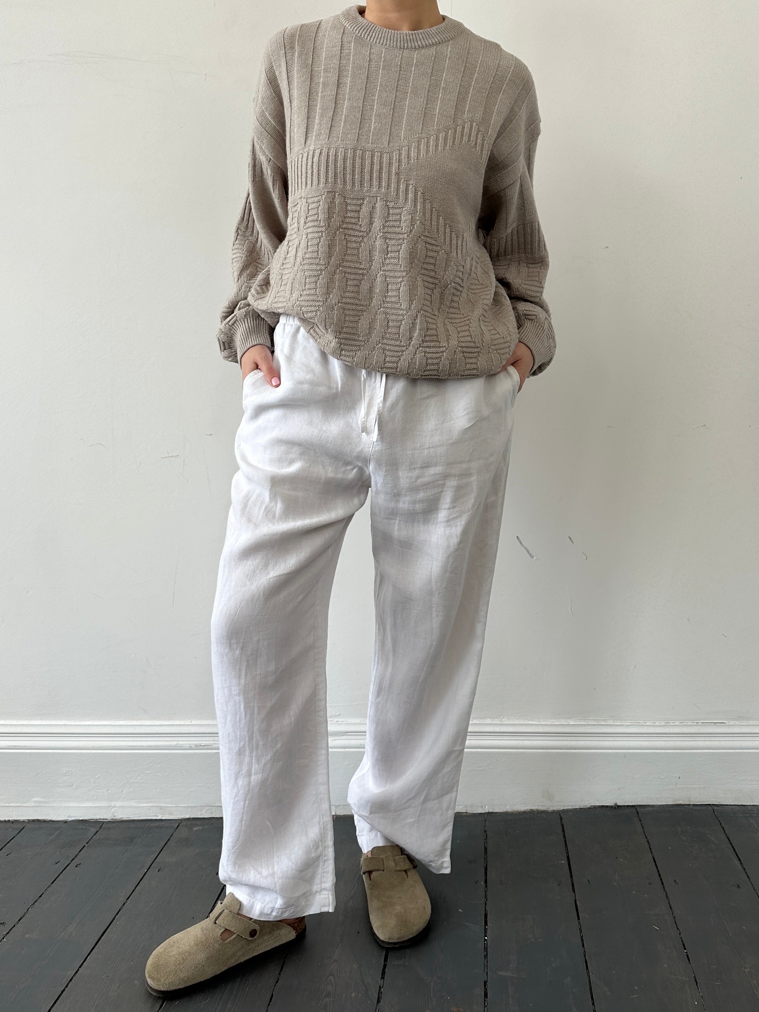 Vintage brand vintage knitted wool jumper in size L, featuring a cozy textured knit design for cold weather.