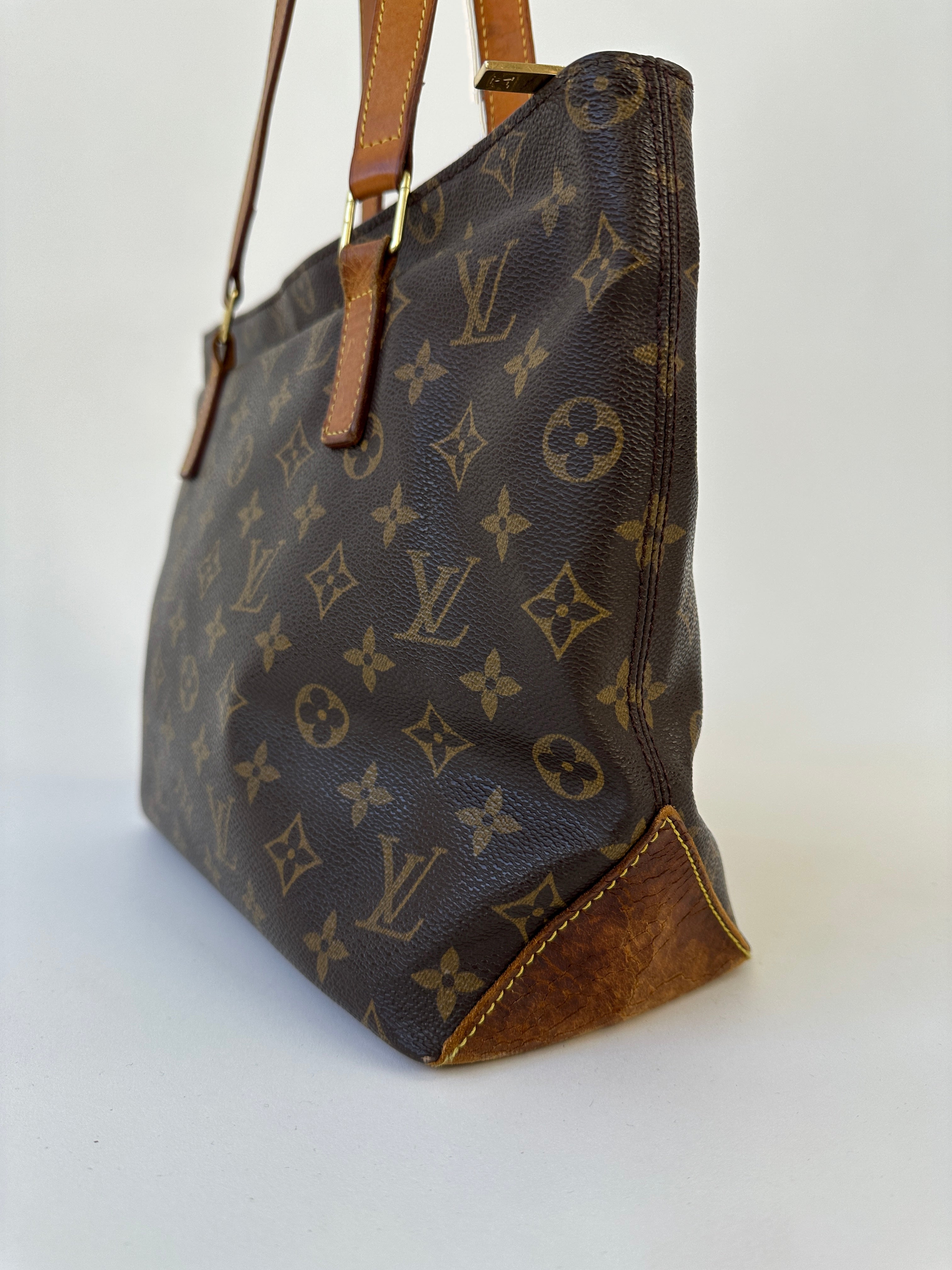 Louis Vuitton Cabas Mezzo Monogram shoulder bag with leather handles and classic LV monogram print, stylish and spacious.