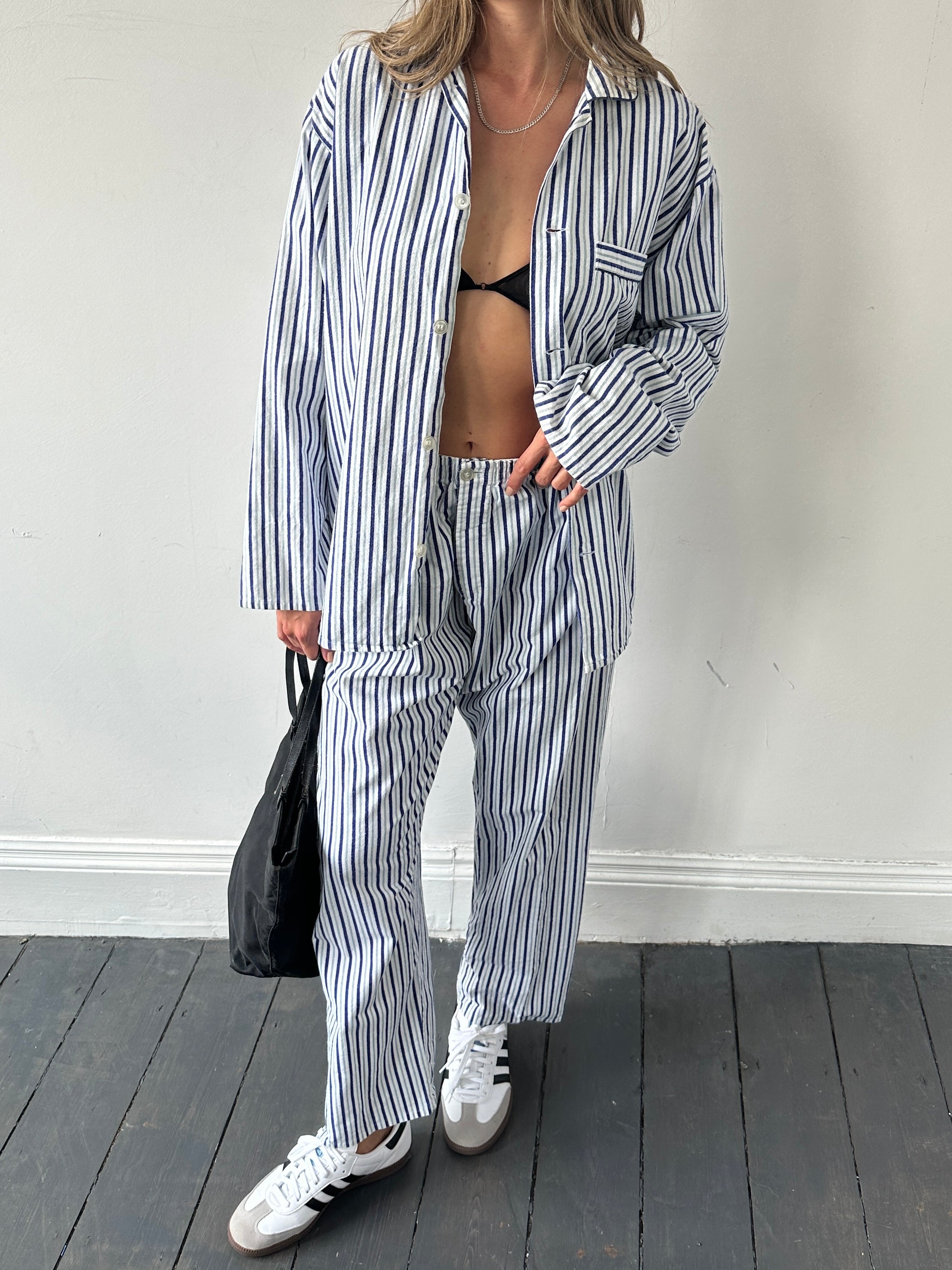 St Michael brushed cotton stripe two-piece pyjama set featuring a long-sleeve top and matching pants in blue and white.