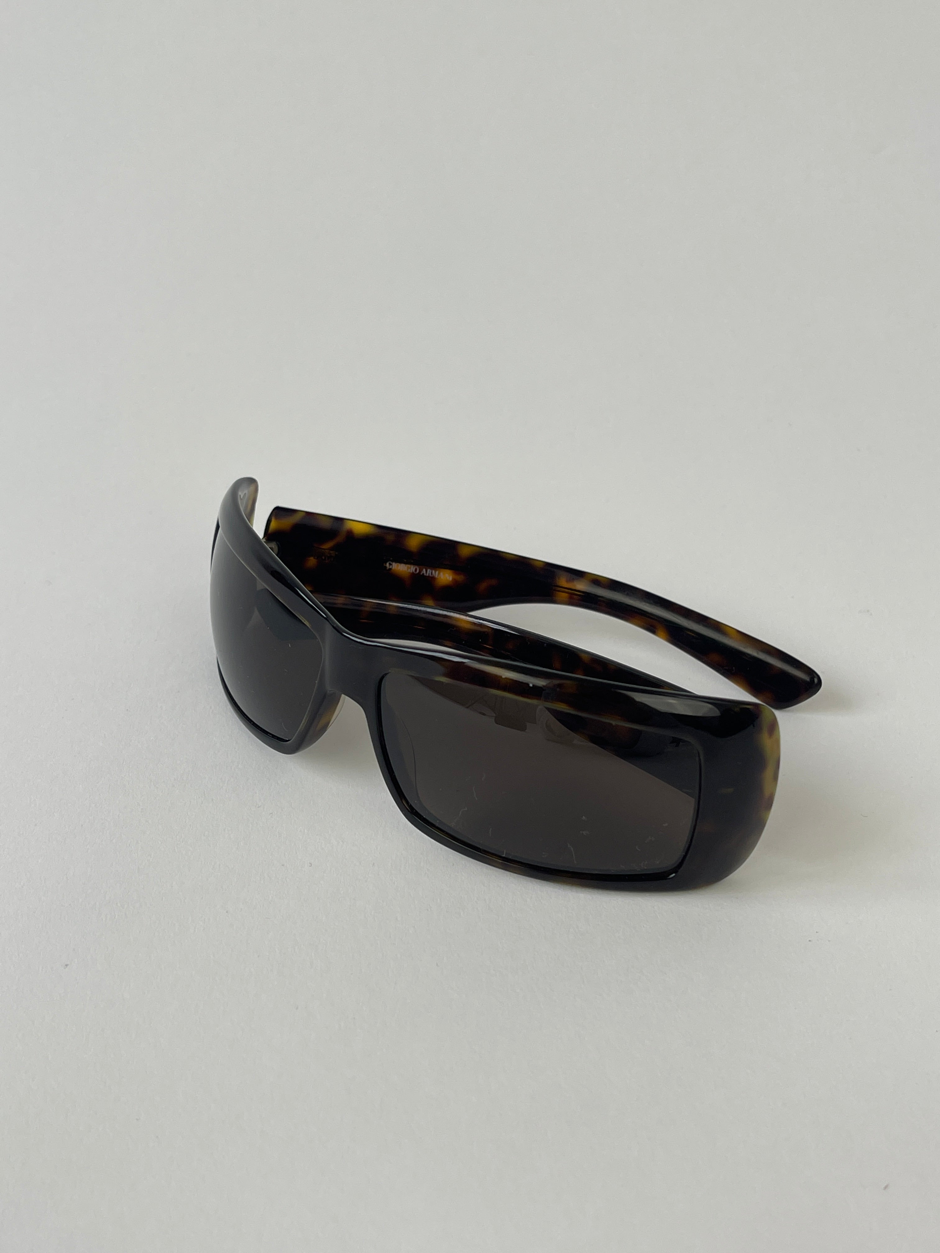 Giorgio Armani rectangle tortoise shell sunglasses with brown lenses and classic frame design.