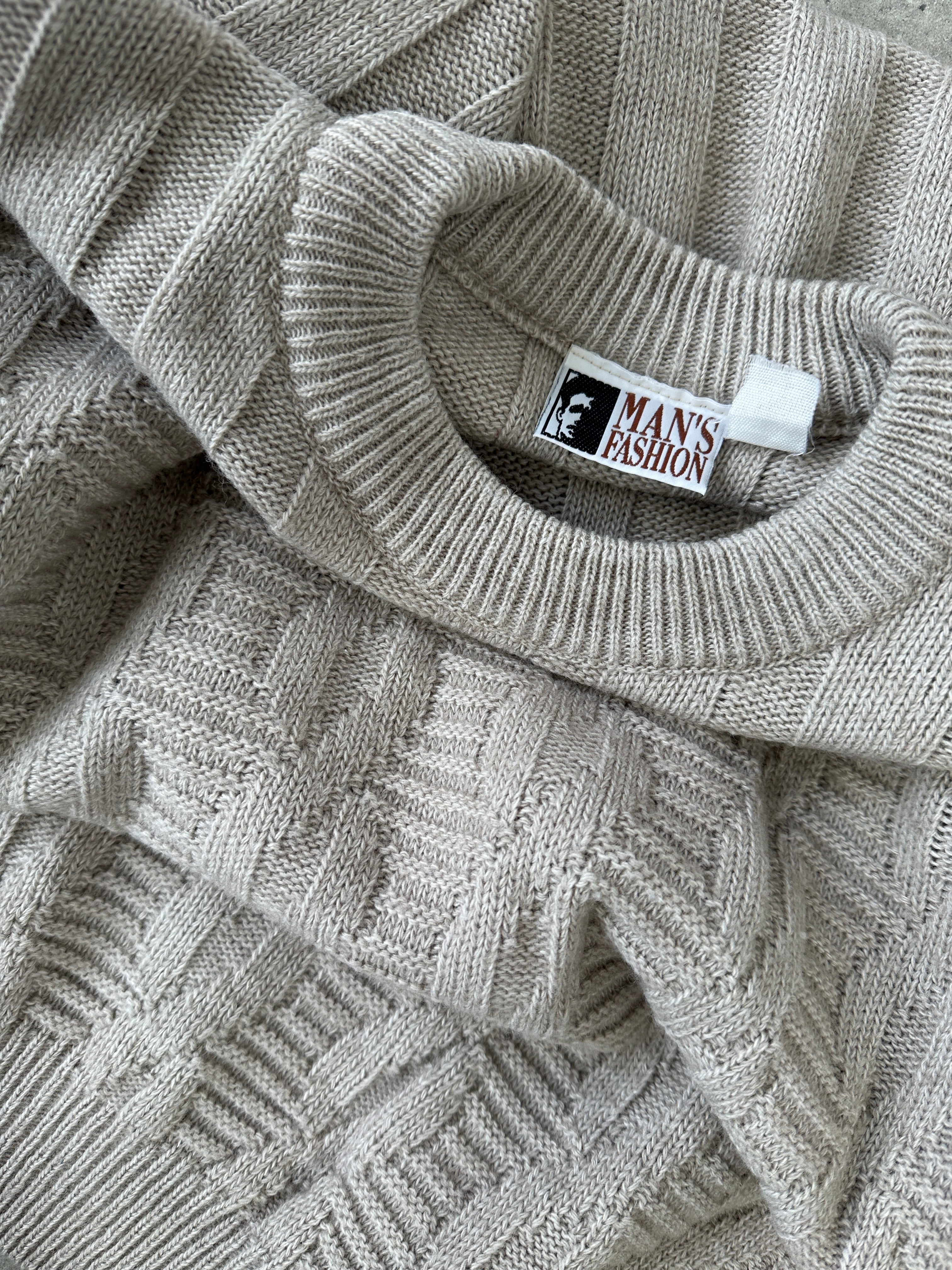 Vintage brand vintage knitted wool jumper in size large, featuring a cozy, textured knit pattern and classic design.