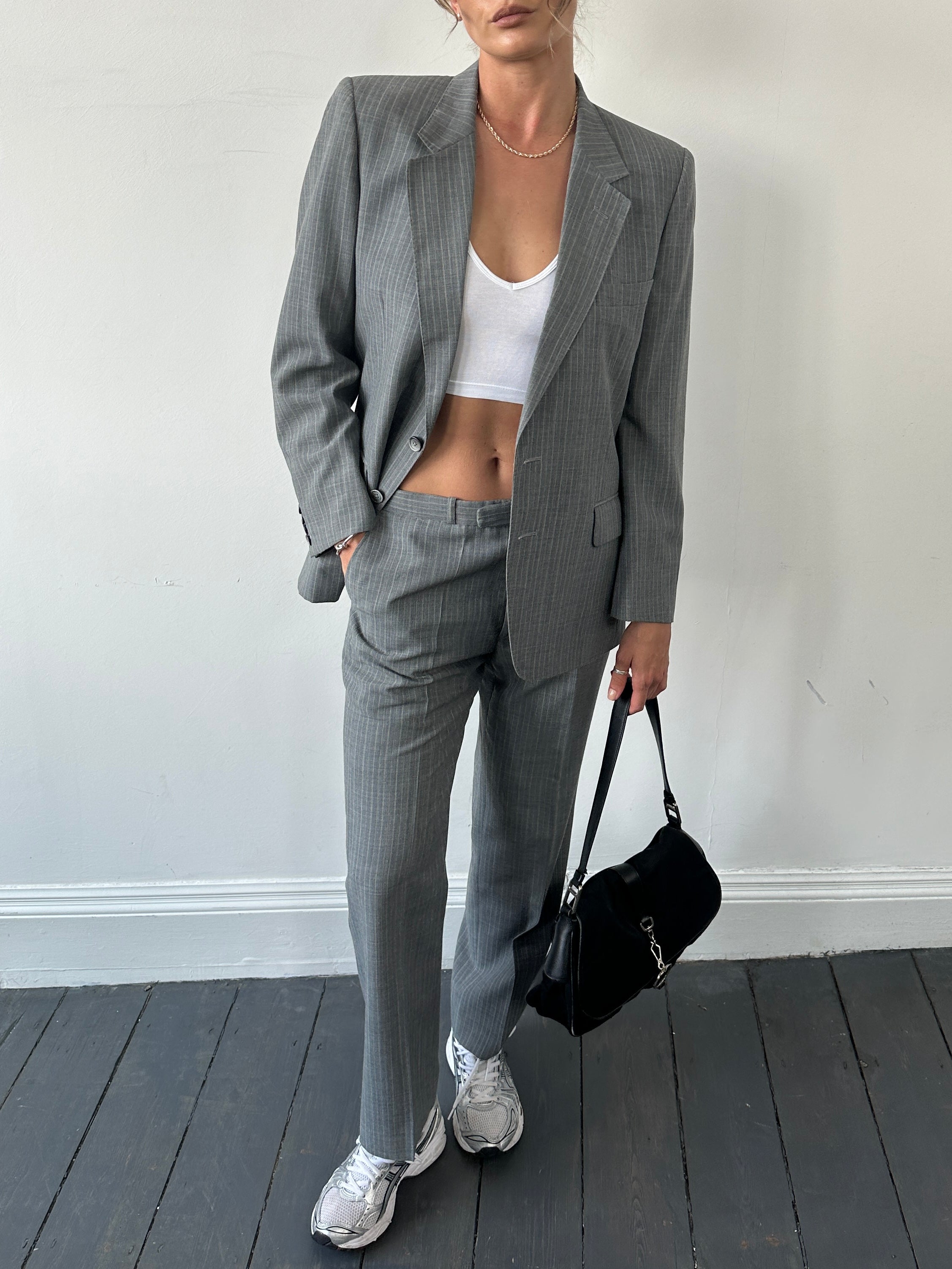 Christian Dior Monsieur pinstripe wool single-breasted jumpsuit in size 40S/W34, featuring a tailored fit and classic pinstripe pattern.