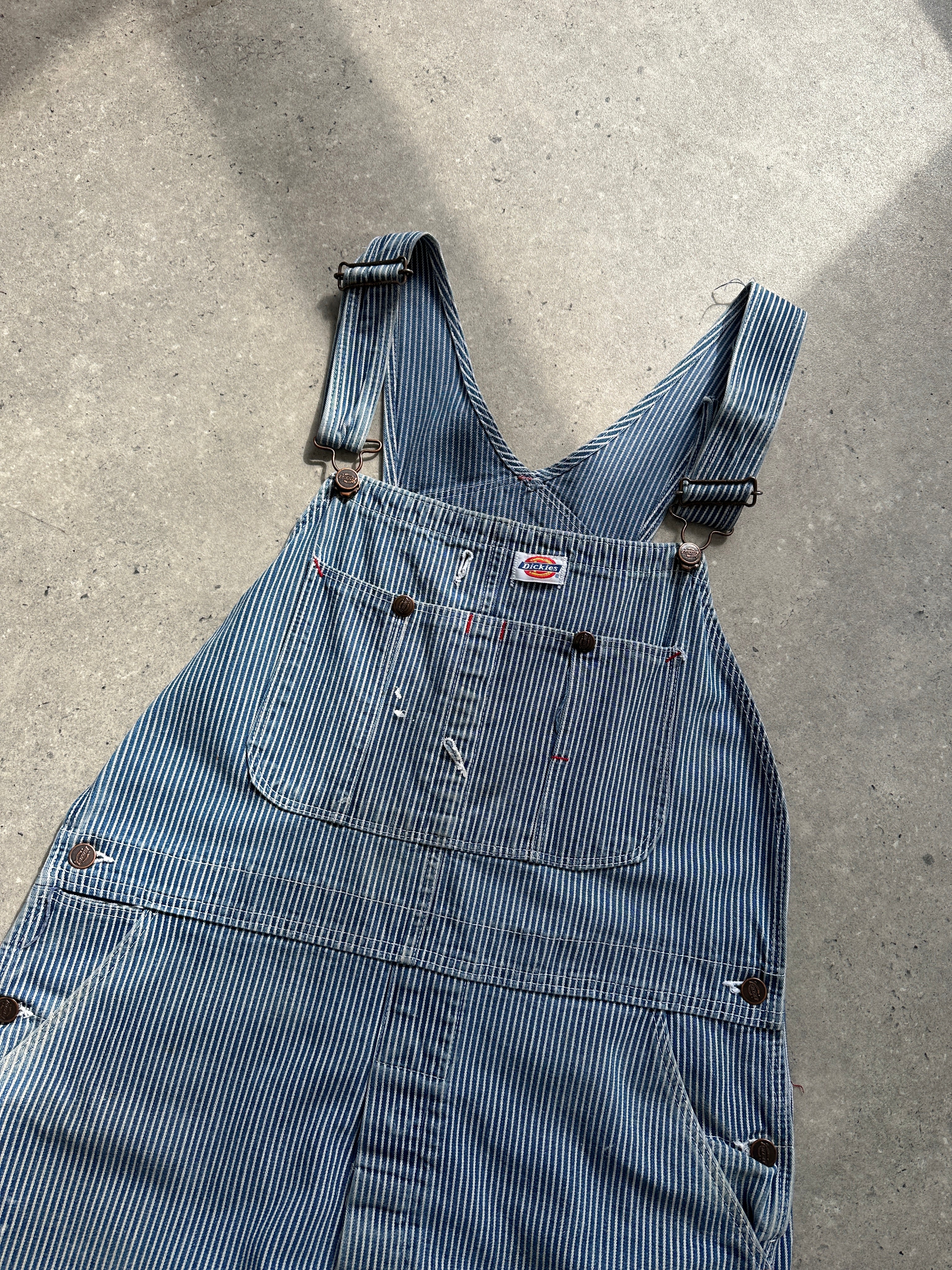 Dickies pinstripe pure cotton dungarees in size M/L, showing the classic bib front and adjustable shoulder straps.