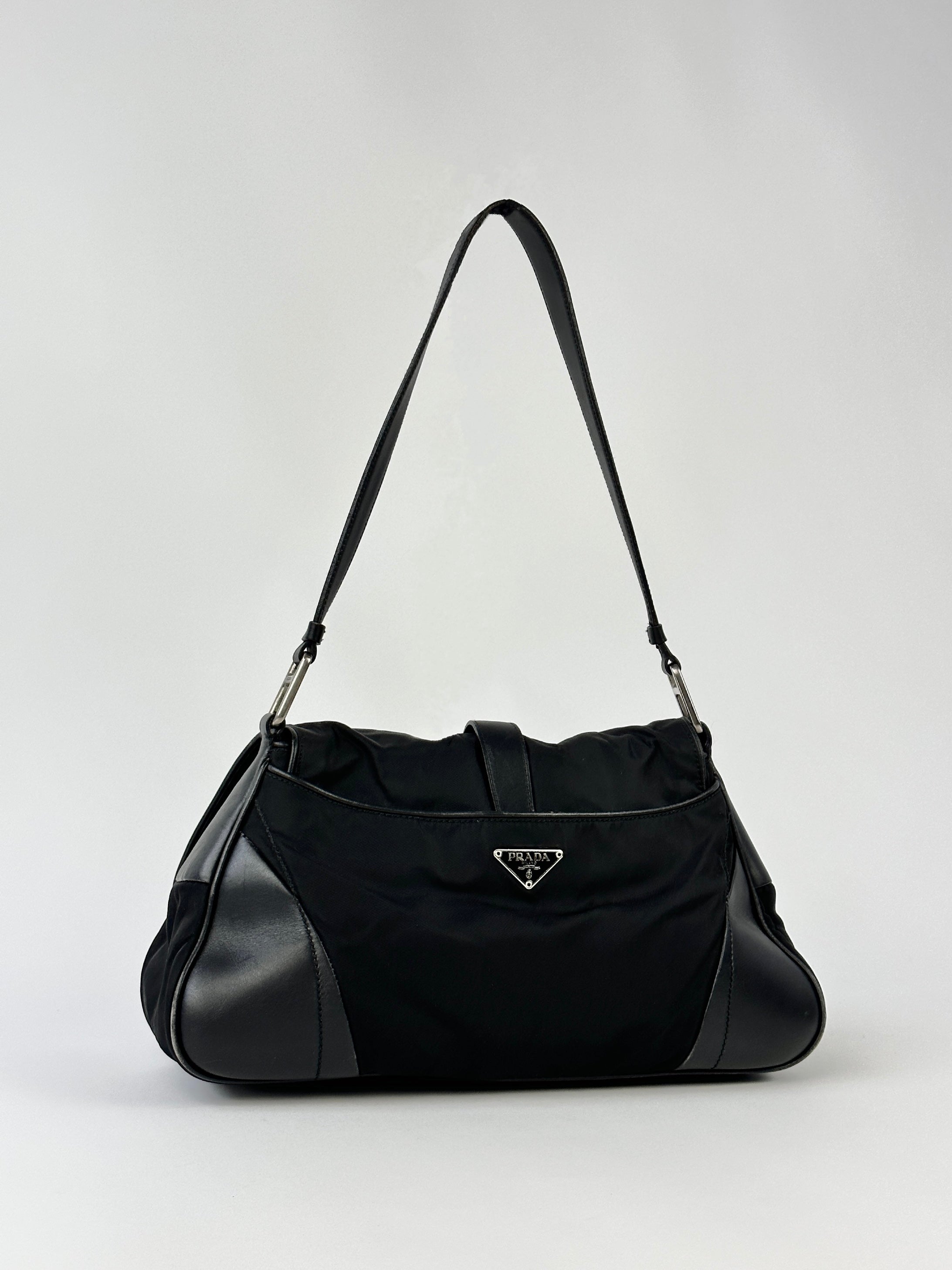 Prada 2000s Tessuto nylon double-sided shoulder bag with adjustable strap and Prada logo, stylish and functional accessory.