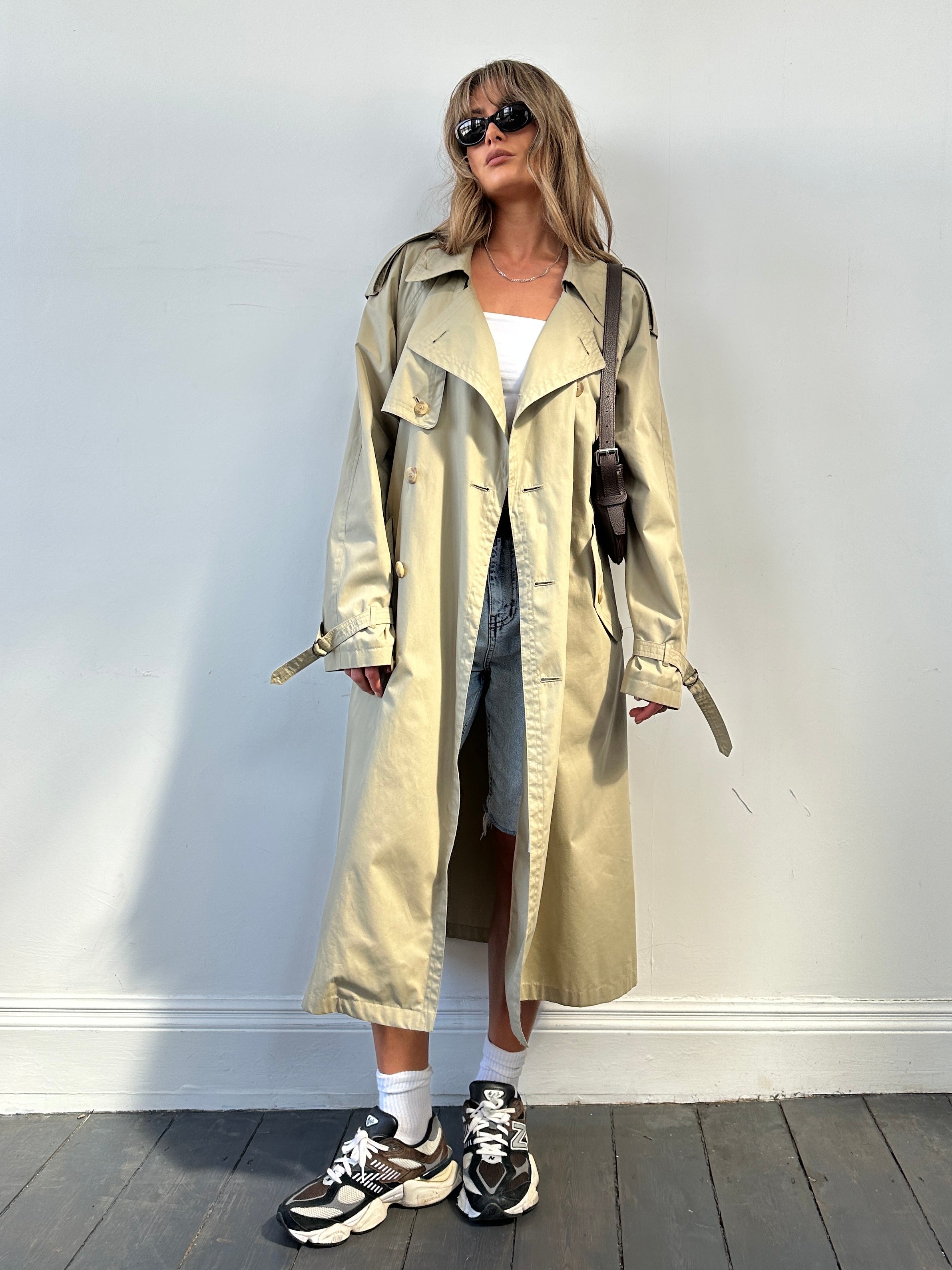 Yves Saint Laurent double-breasted trench coat in size L/XL, classic beige color, tailored fit, and stylish design.
