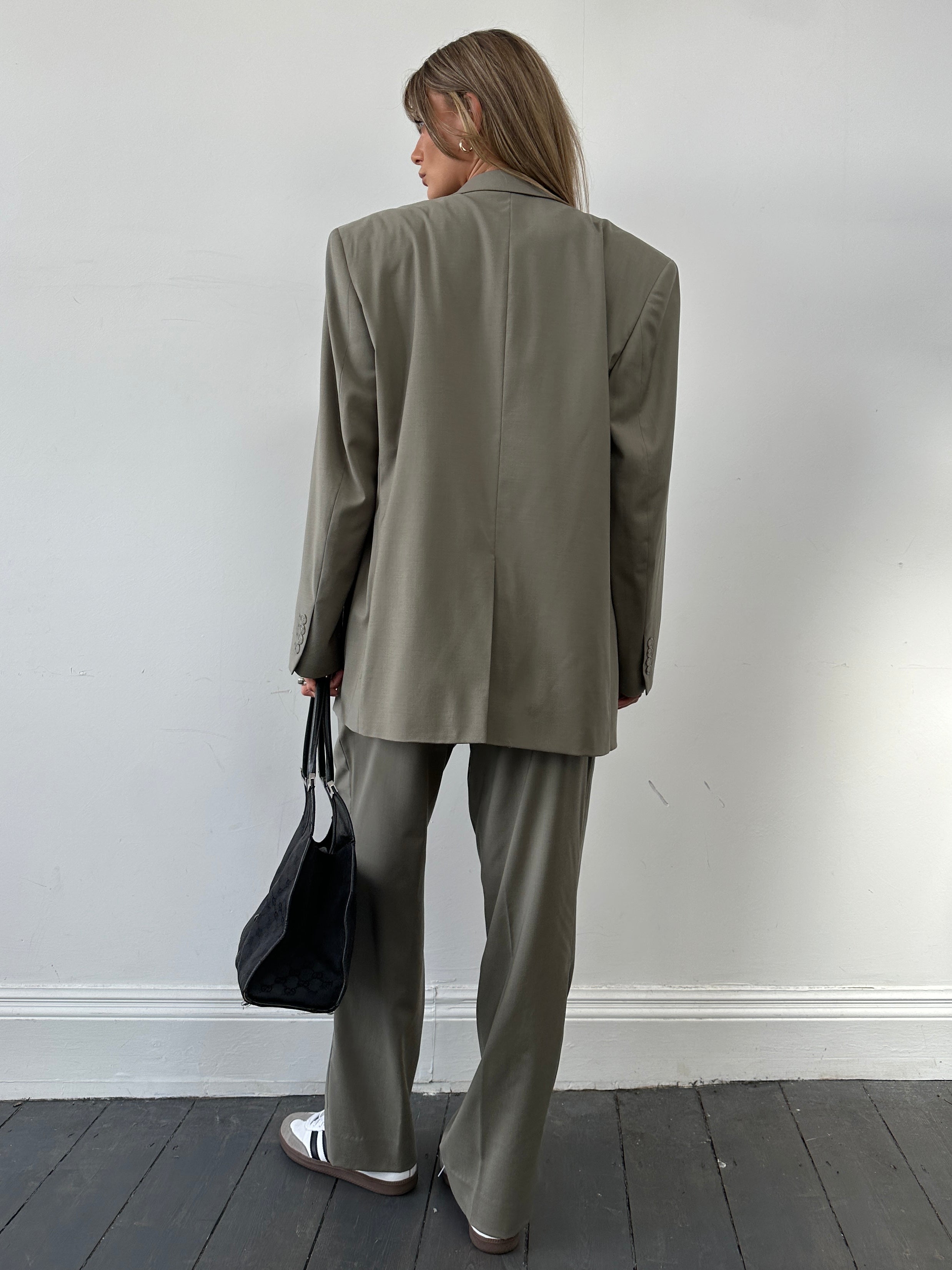 Vintage wool single-breasted jumpsuit in size 44R/W34, featuring classic tailoring and a tailored fit.