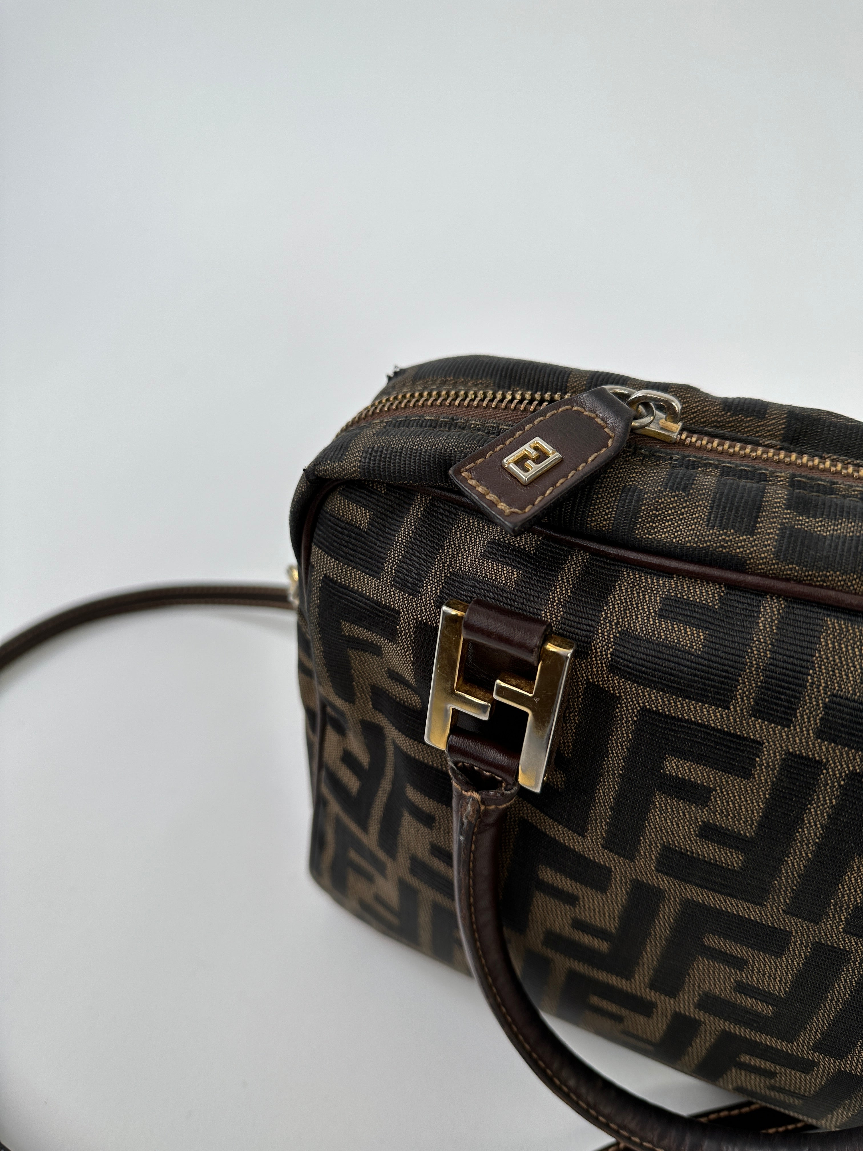 Fendi Zucca Monogram Crossbody Bag with beige and brown Fendi logo pattern and adjustable strap, stylish and compact accessory.
