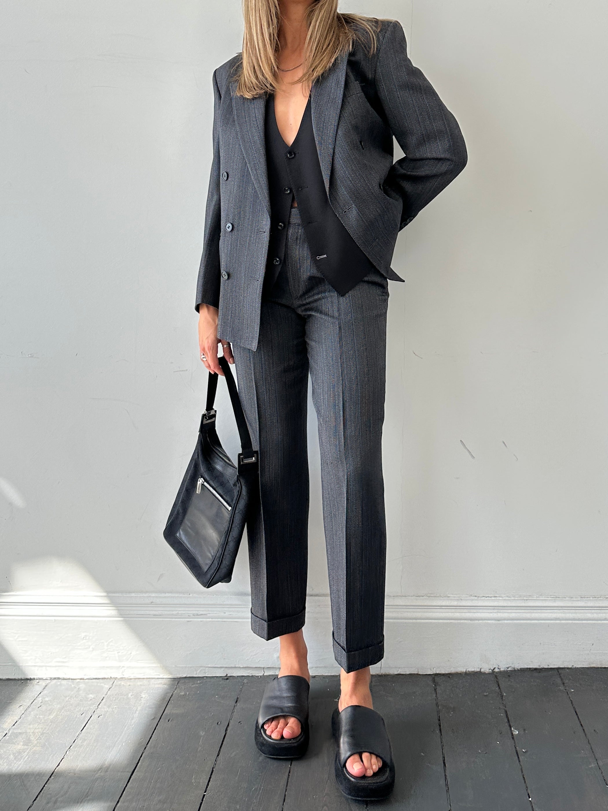 Christian Dior silk wool pinstripe single-breasted jumpsuit in size 36S/W28, featuring tailored fit and stylish pinstripes.