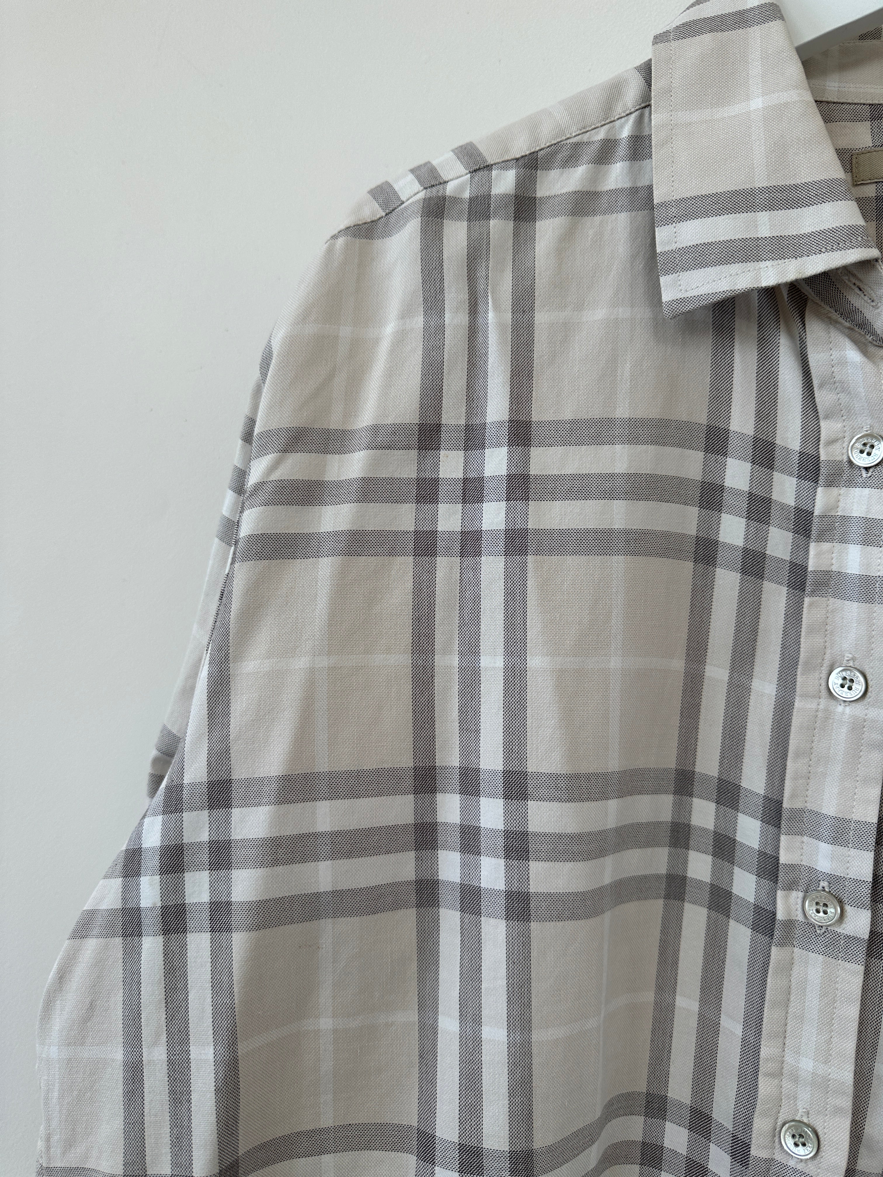 Burberry London Check cotton shirt in size L, featuring the iconic plaid pattern, displayed on a hanger.