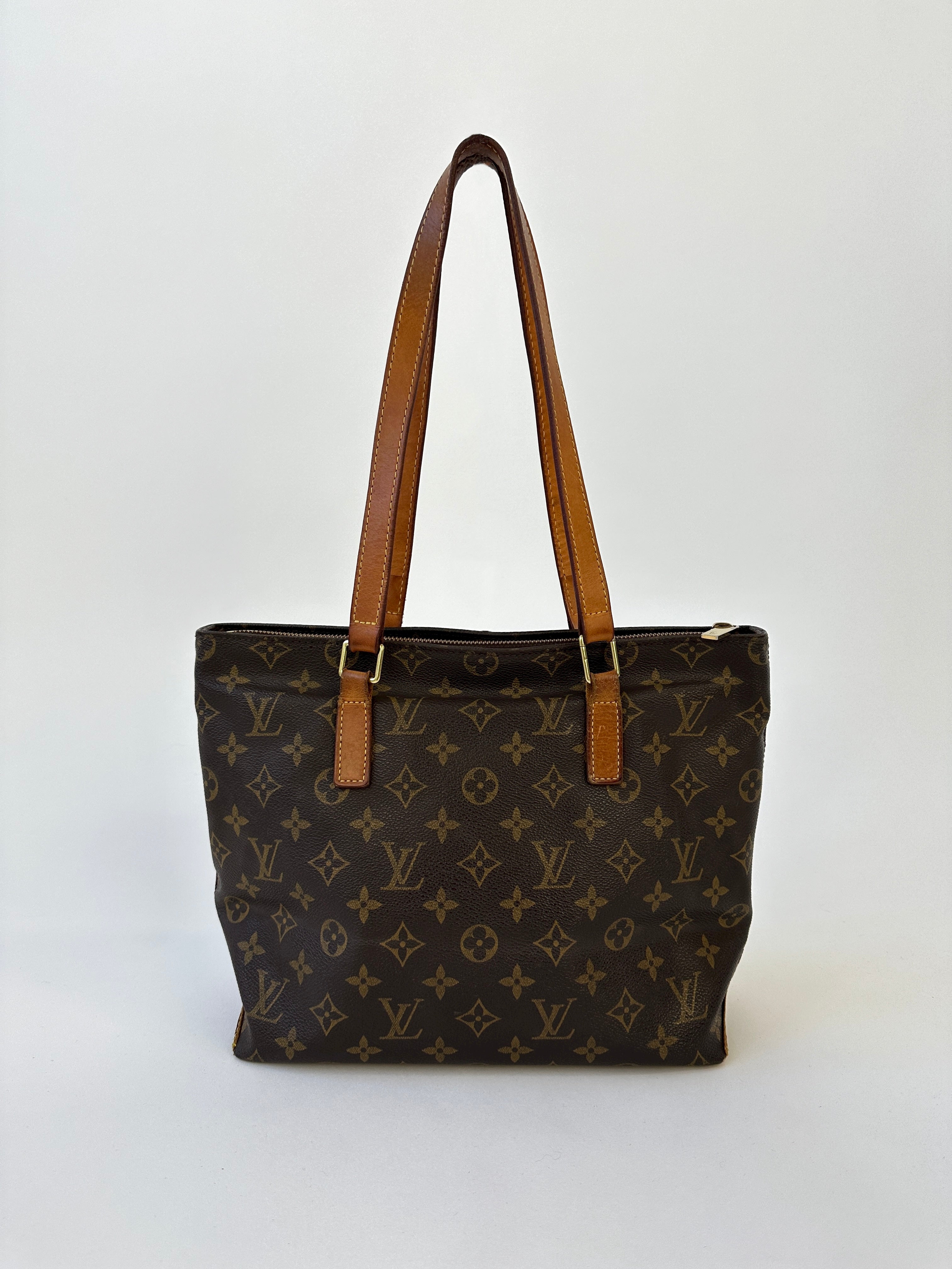 Louis Vuitton Cabas Mezzo Monogram shoulder bag with leather handles and spacious interior, featuring the iconic LV monogram print.
