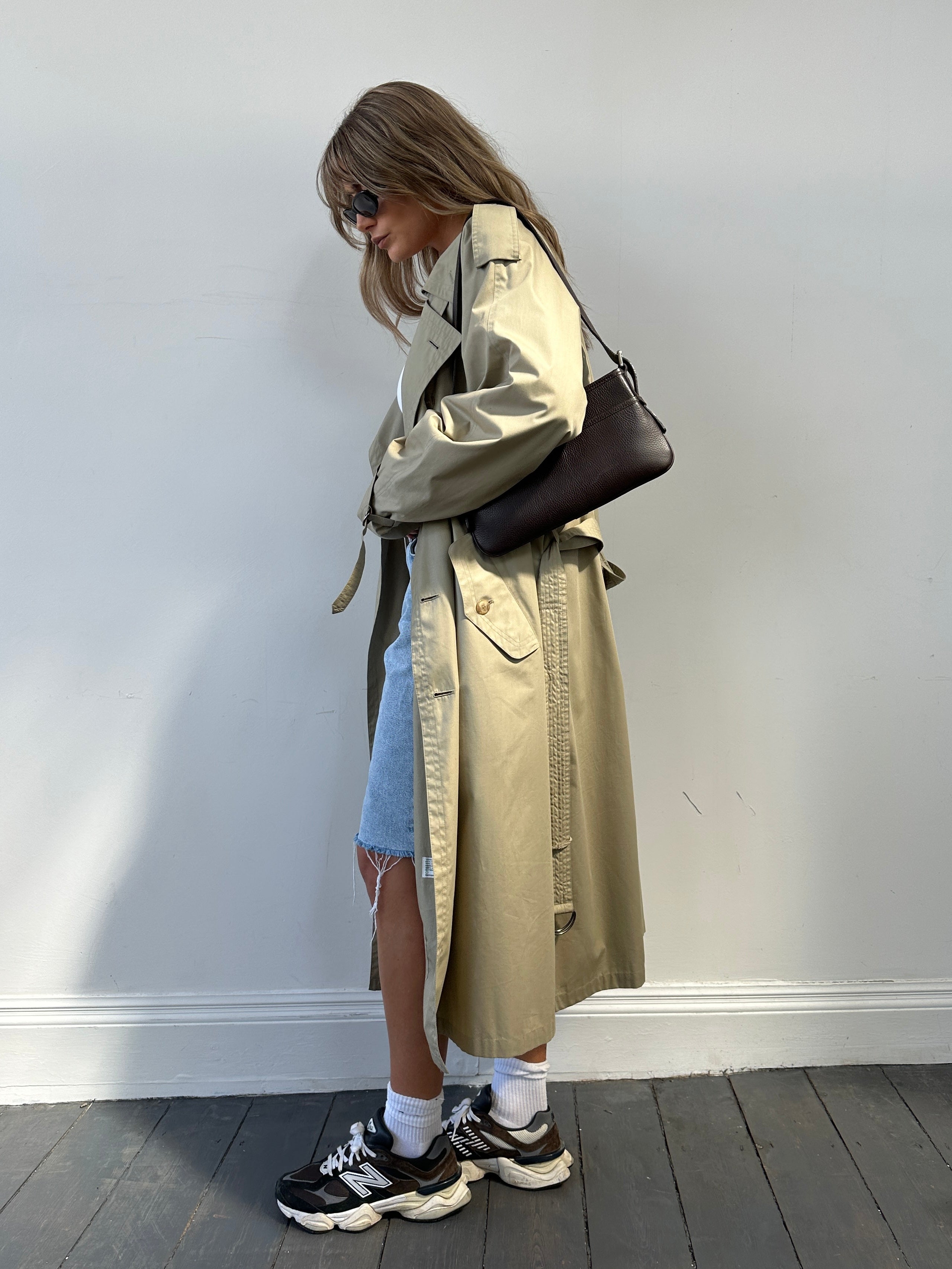 Yves Saint Laurent double-breasted trench coat in size L/XL, stylish beige coat with classic lapels and button details.