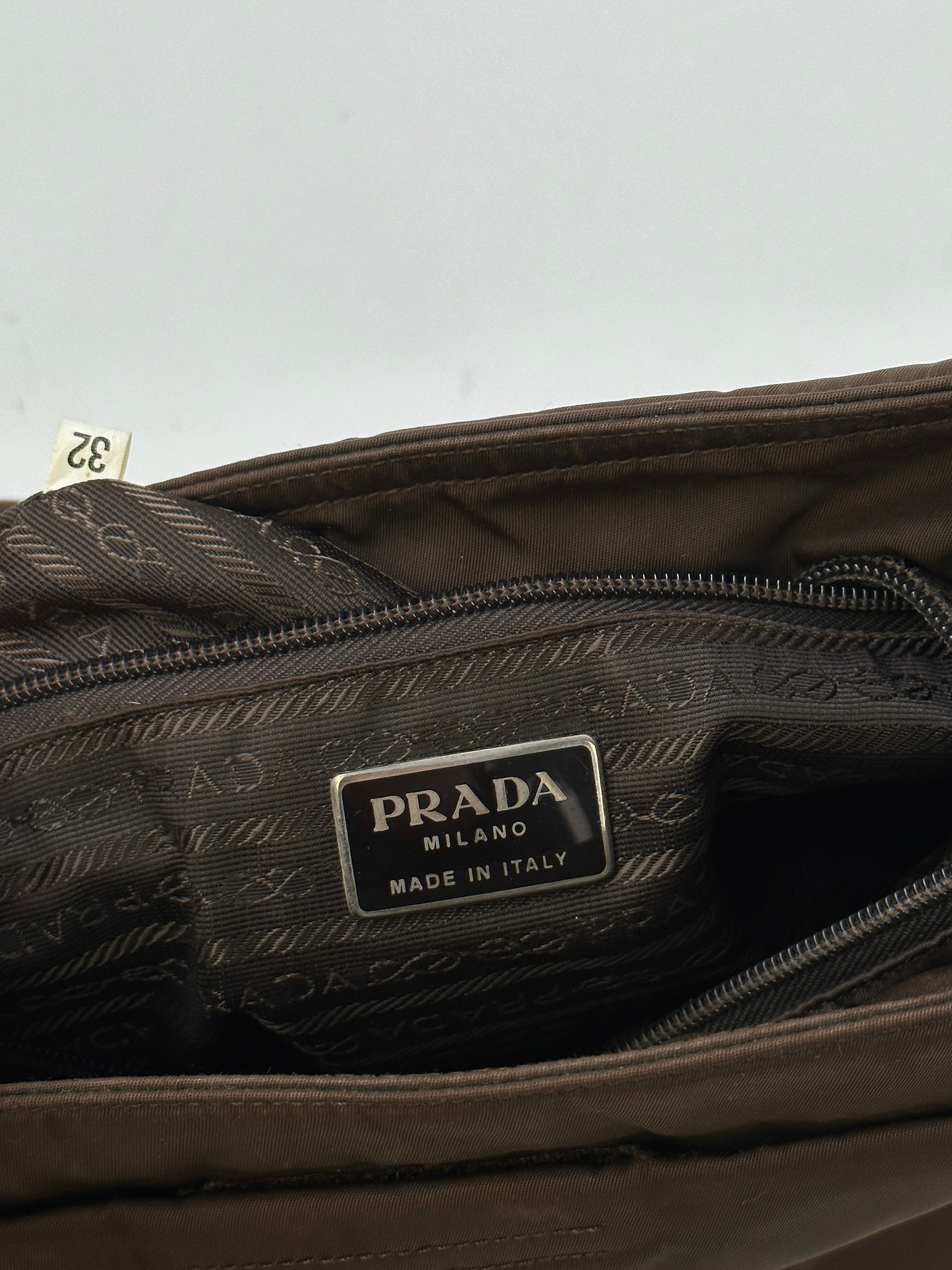 Prada Tessuto nylon tote bag with top handles, spacious interior, and minimalist design, perfect for everyday use.