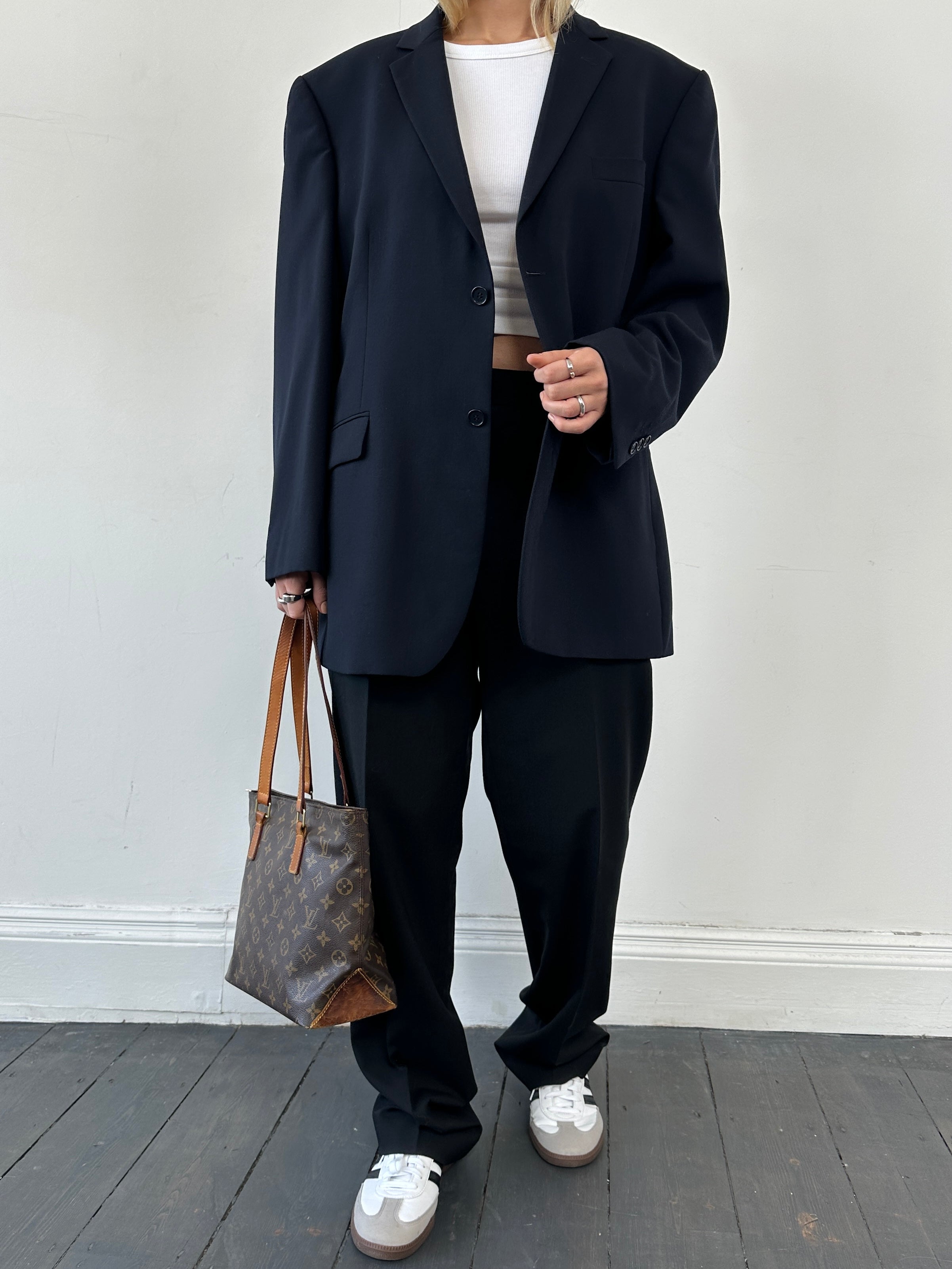 Balmain Paris single-breasted wool blazer in size 44R/L, featuring classic tailored design and structured fit.