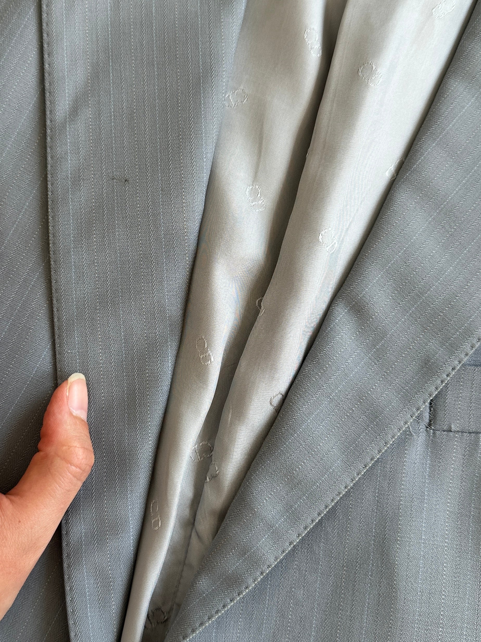 Christian Dior Monsieur pinstripe wool single-breasted jumpsuit in size 40S/W34, featuring tailored lapels and classic pinstripe pattern.