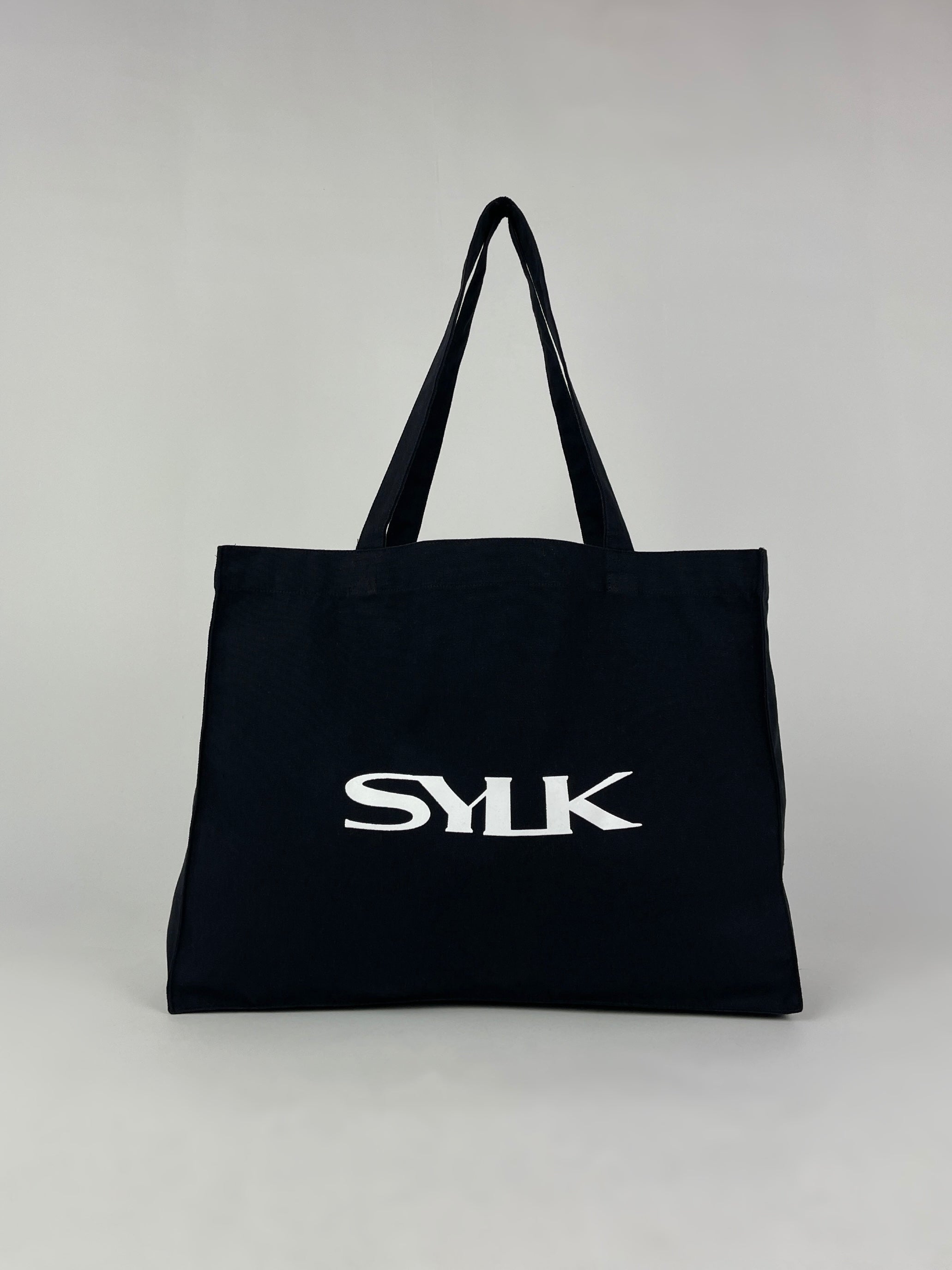 SYLK recycled cotton tote bag with sturdy handles and eco-friendly design, ideal for daily use and shopping.