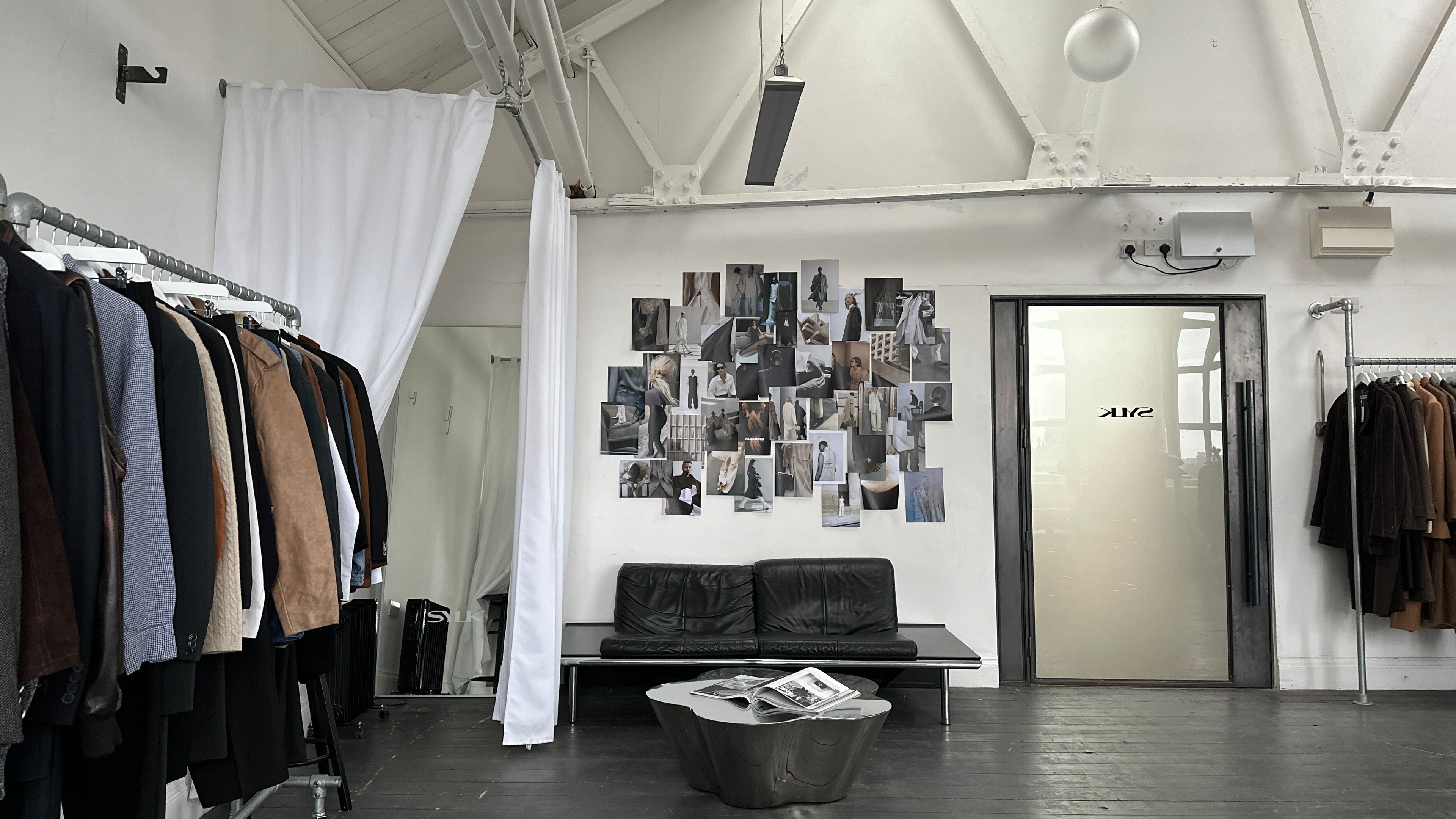 Vintage-style studio appointment space in Manchester with minimalist decor, featuring modern furniture and ambient lighting.