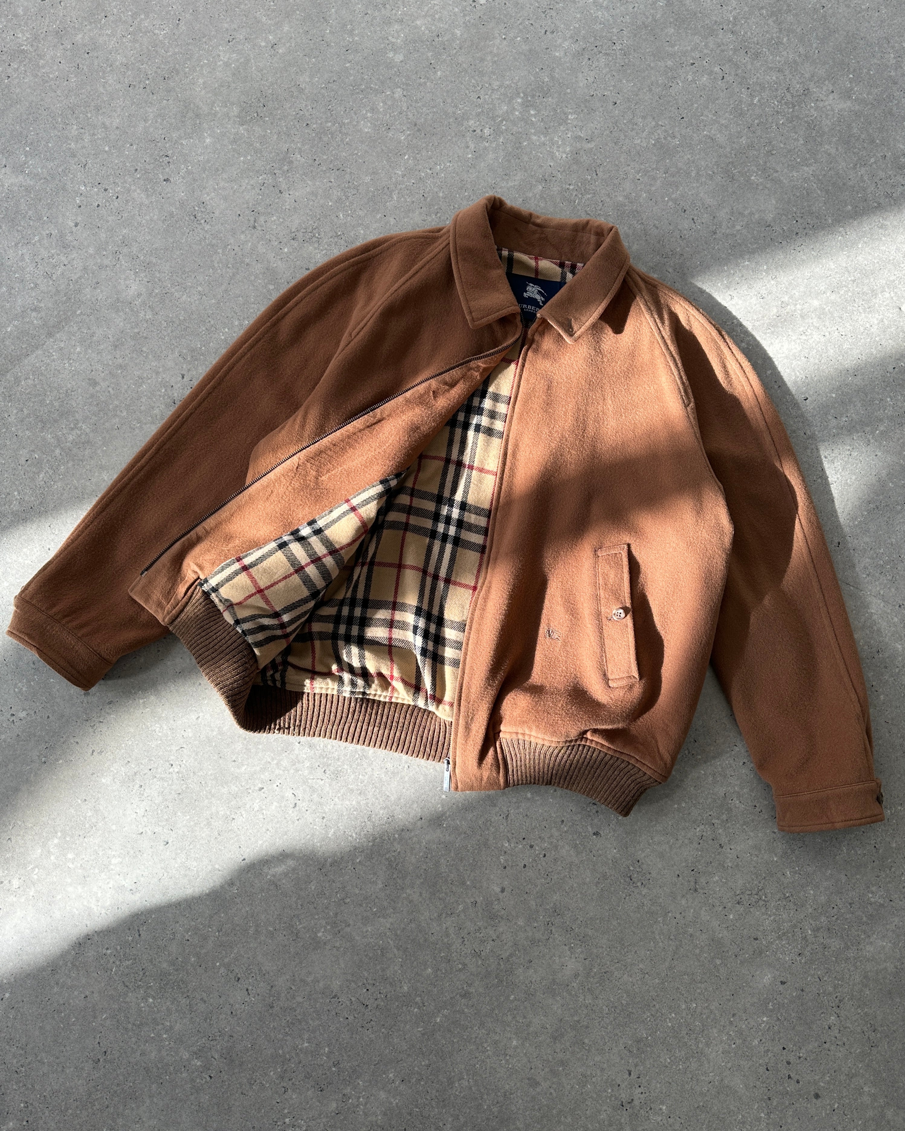 Burberry London Wool Nova Check Logo Bomber Jacket in brown with checked pattern and logo embroidery, front view.