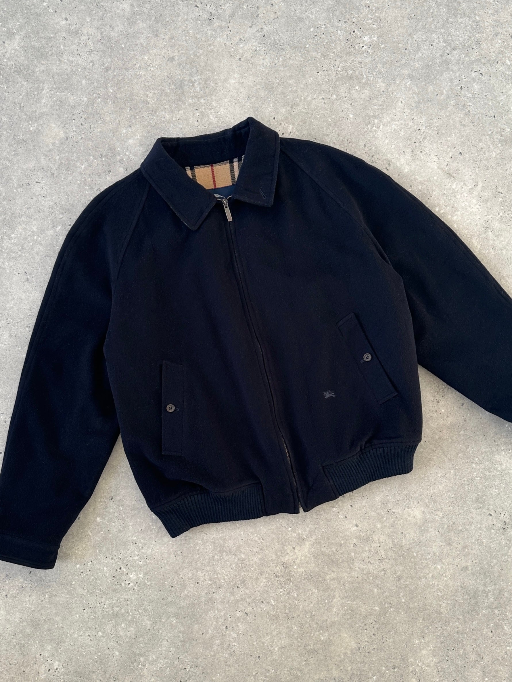 Navy Burberry London wool bomber jacket with Nova Check logo, featuring a zip front, ribbed cuffs, and a modern fit.