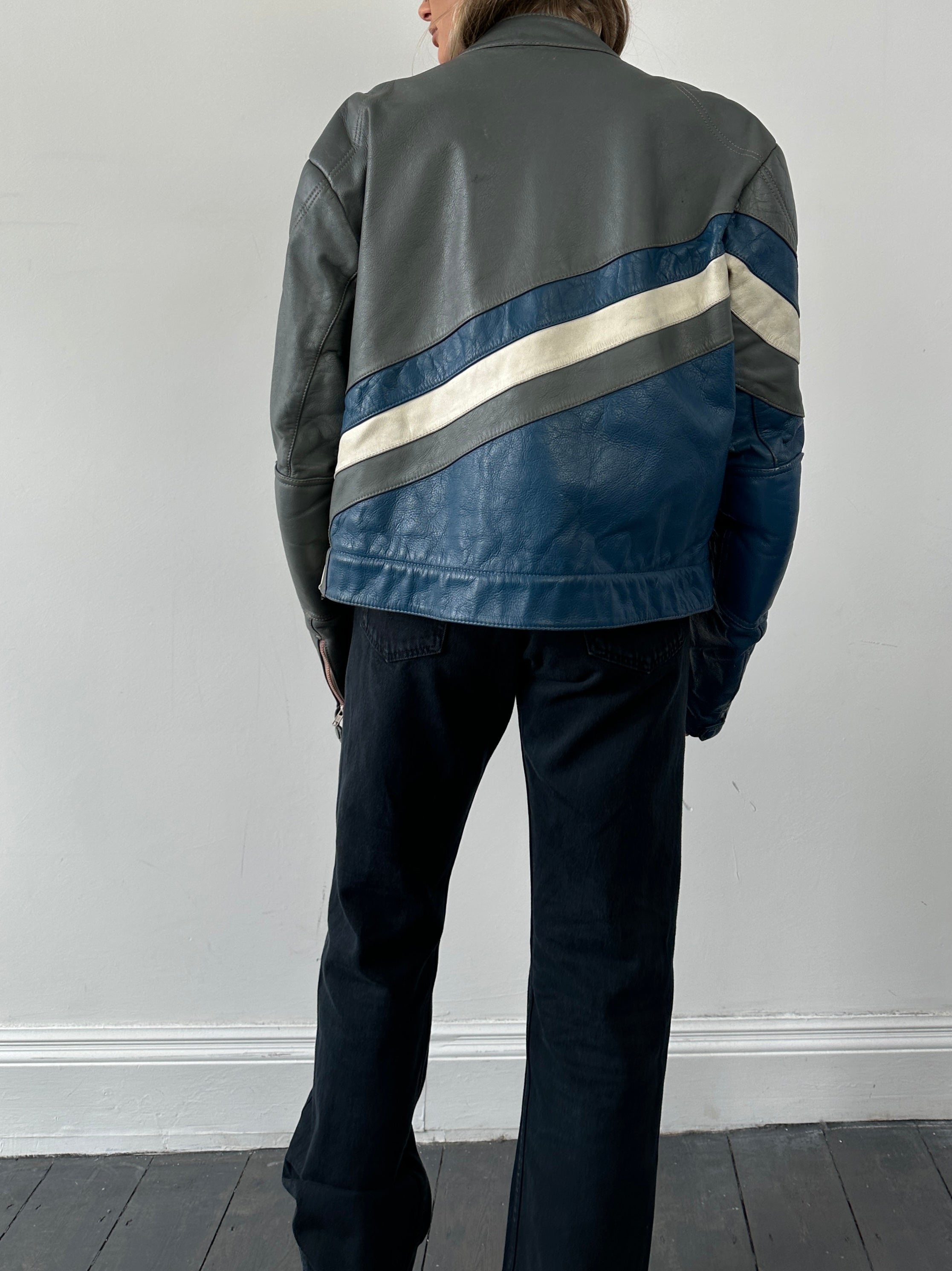 Vintage leather striped motorcycle jacket in size M/L, featuring classic design and bold striped pattern, made by Vintage.
