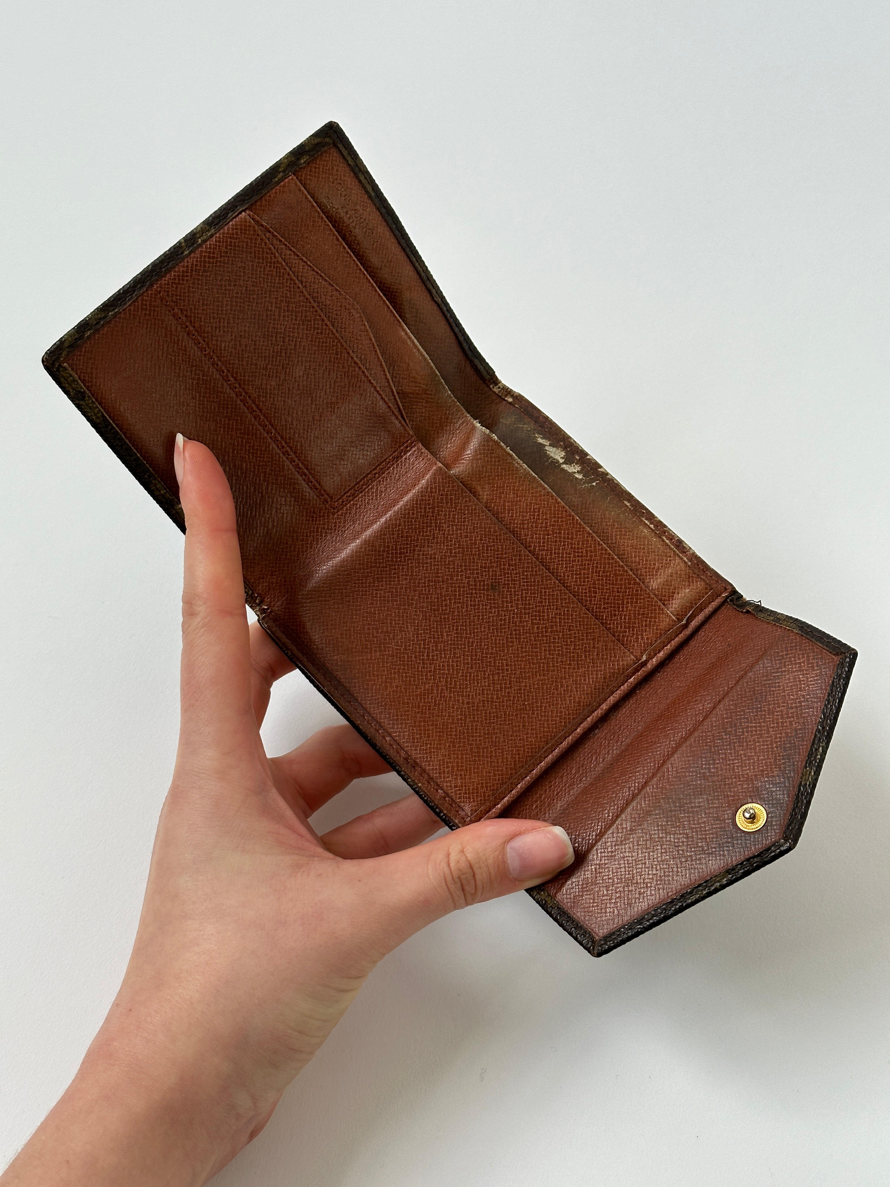 Louis Vuitton 1988 Monogram Wallet with classic LV monogram pattern and leather trim, open to show interior compartments.