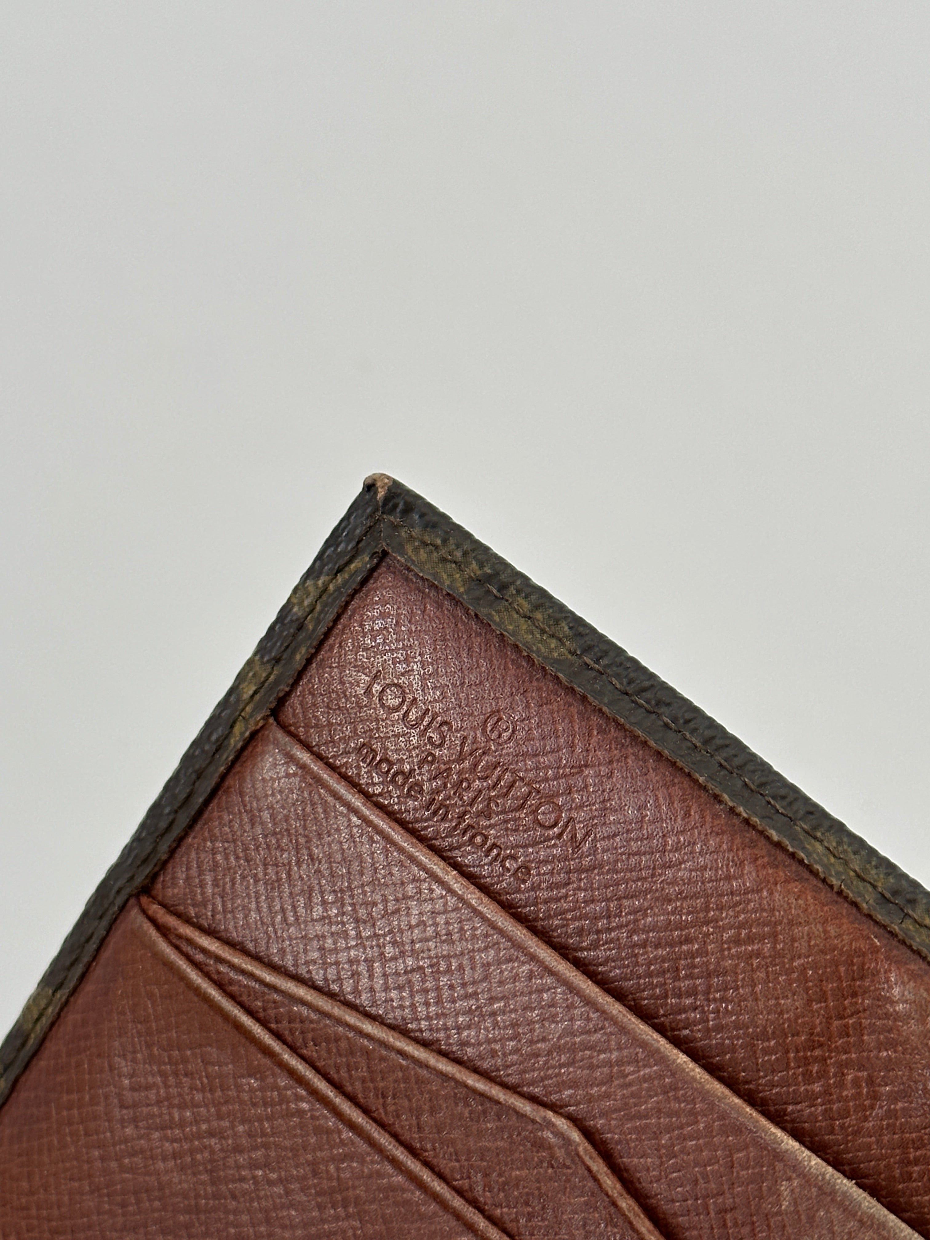 Louis Vuitton 1989 Monogram Wallet showing the classic monogram canvas, zip closure, and leather lining.