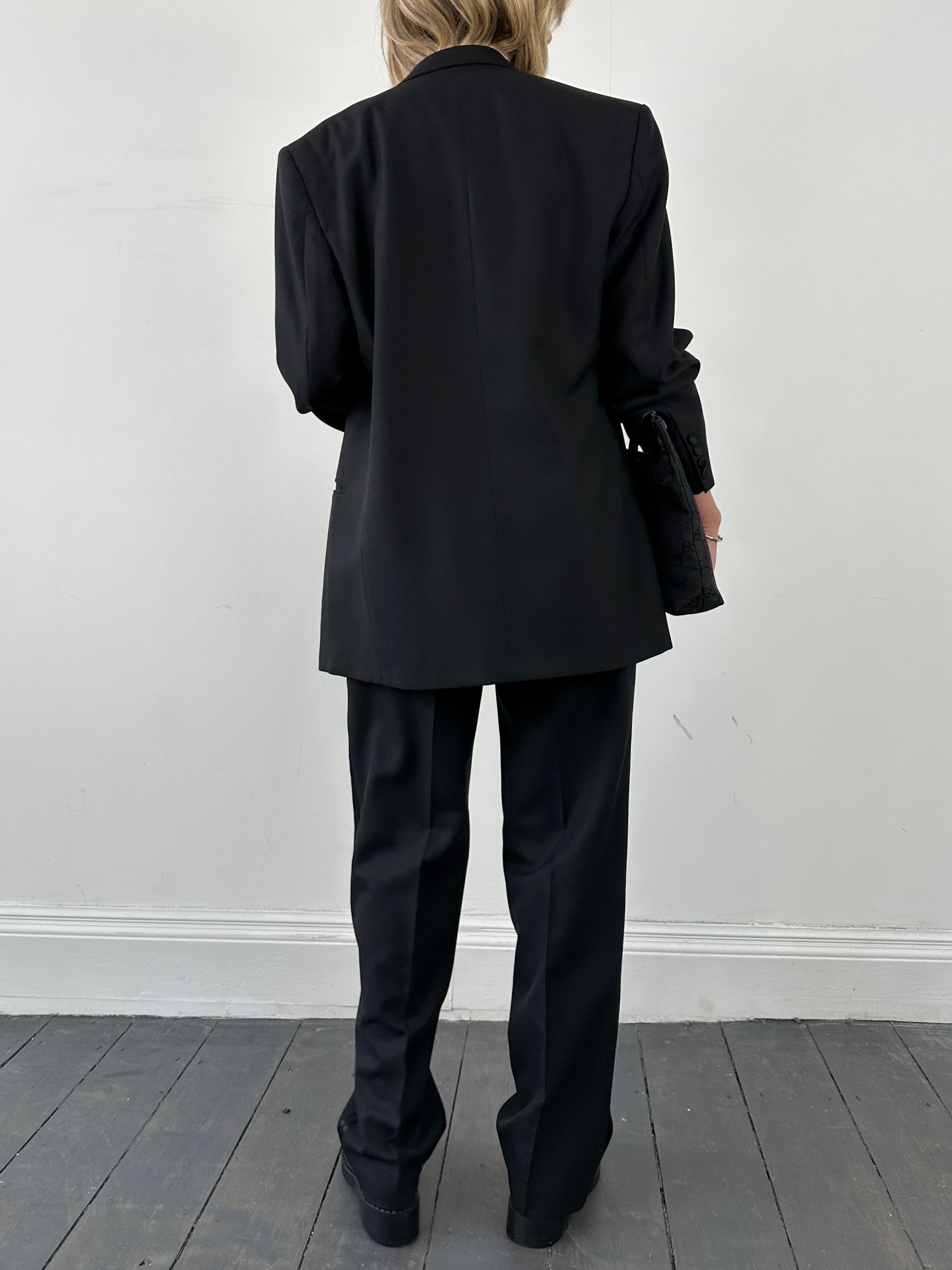 Christian Dior Monsieur tuxedo jumpsuit in double-breasted wool with tailored fit, size 40L/W28, displayed on a mannequin.