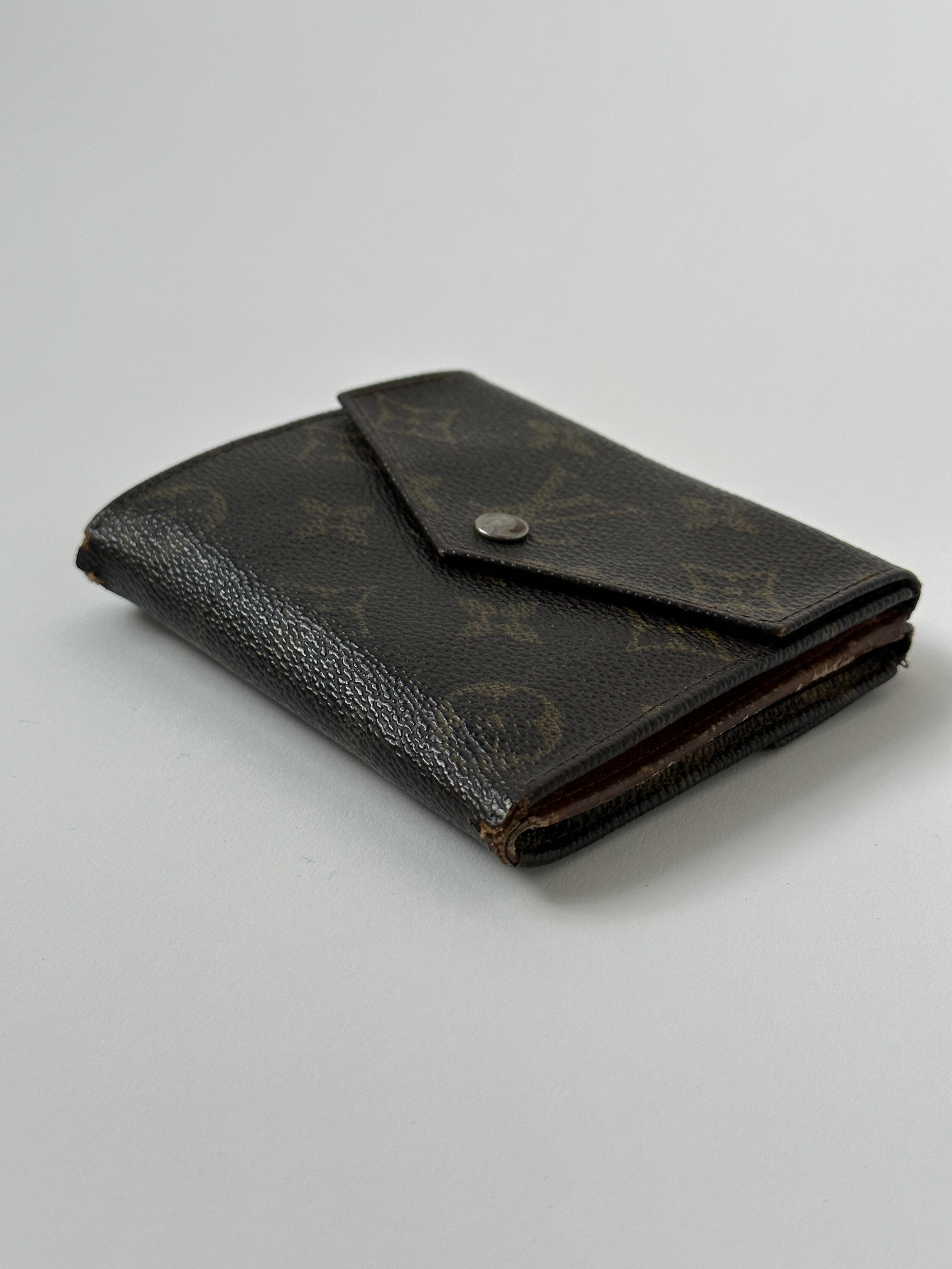 Louis Vuitton 1988 Monogram Wallet showing classic monogram canvas, leather trim, and multiple card slots.