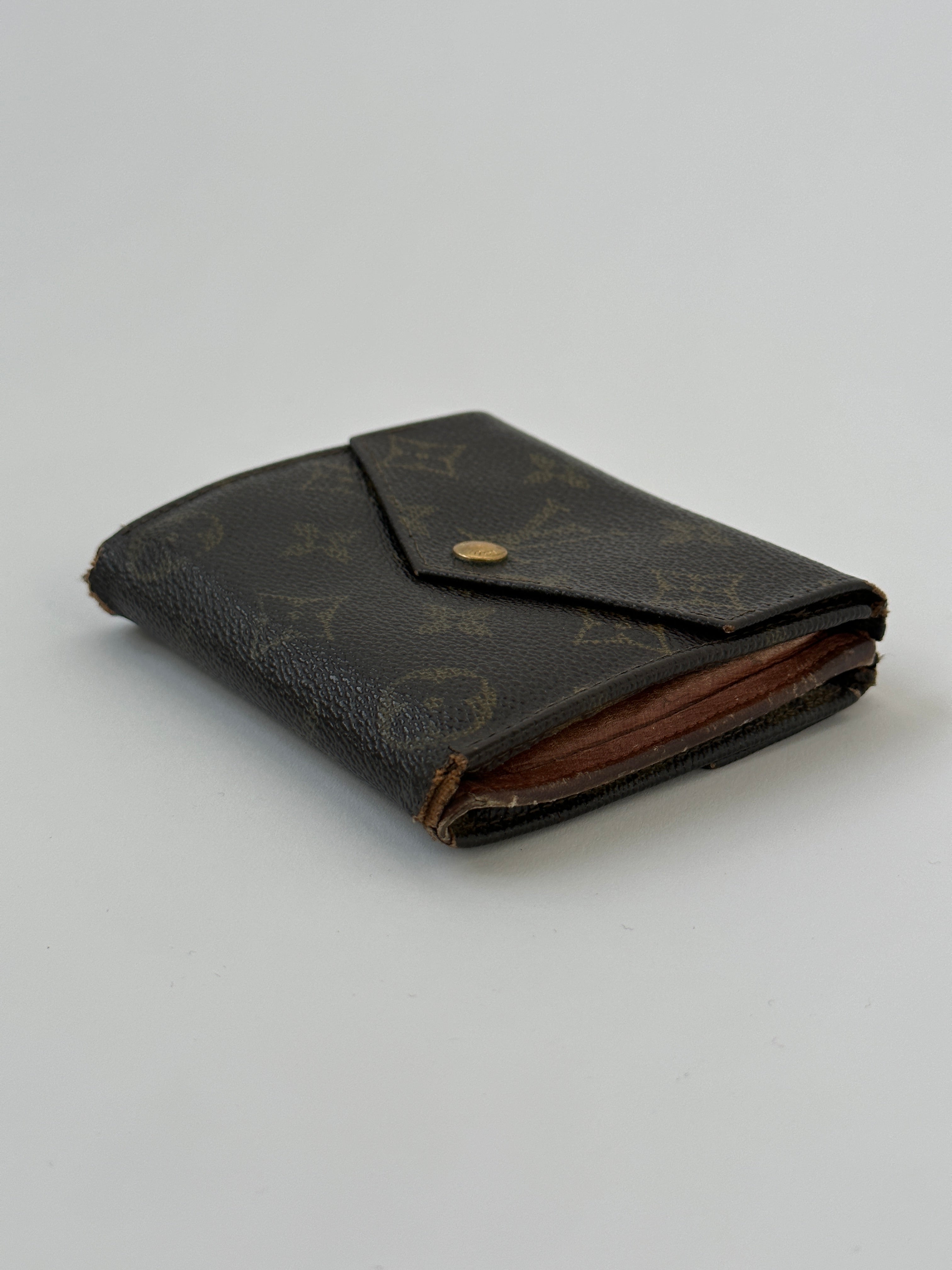 Louis Vuitton 1989 Monogram Wallet showing classic monogram canvas and leather trim with multiple card slots.