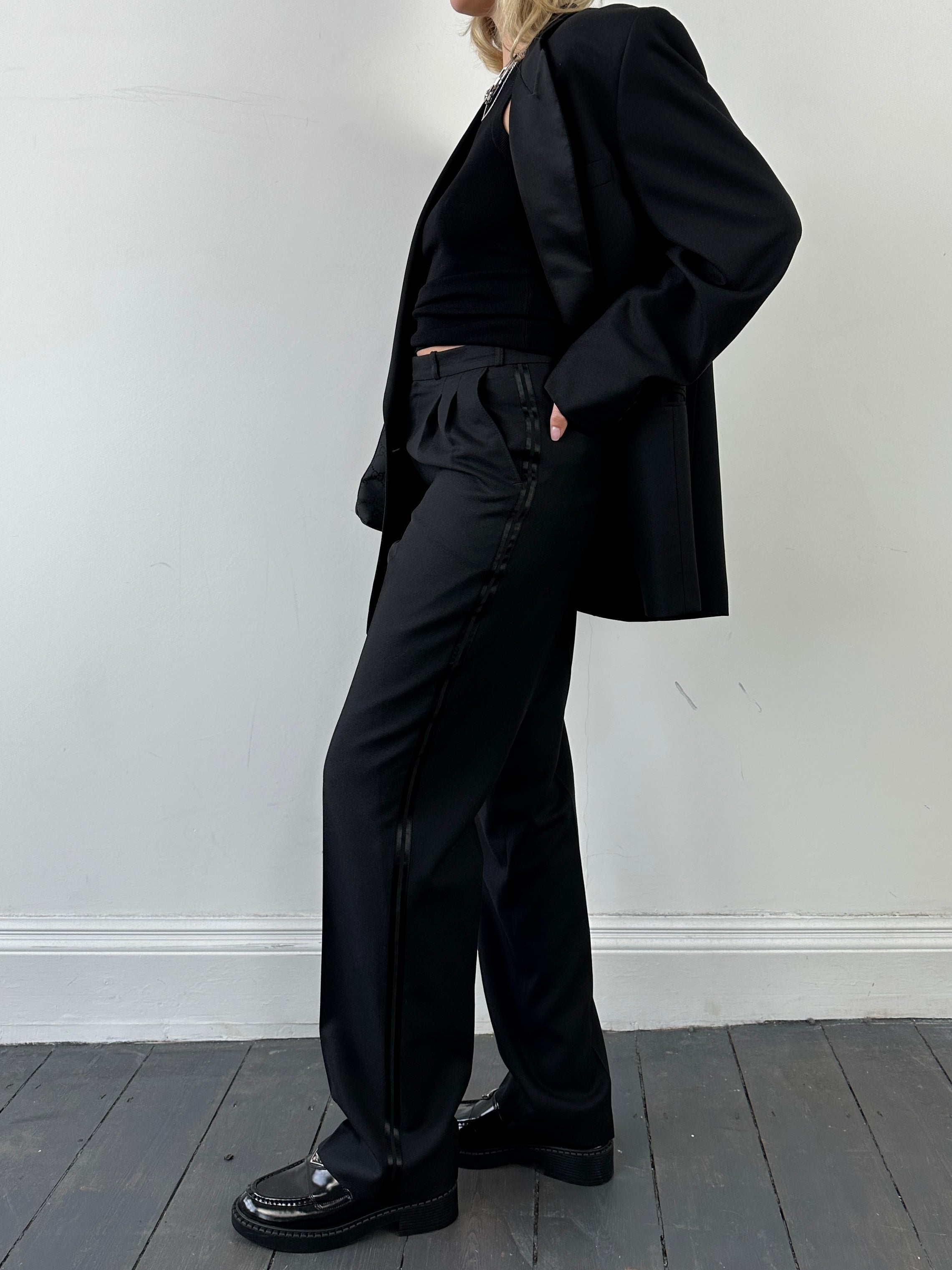 Christian Dior Monsieur tuxedo jumpsuit, double-breasted wool suit in size 40L/W28, displayed on a mannequin.