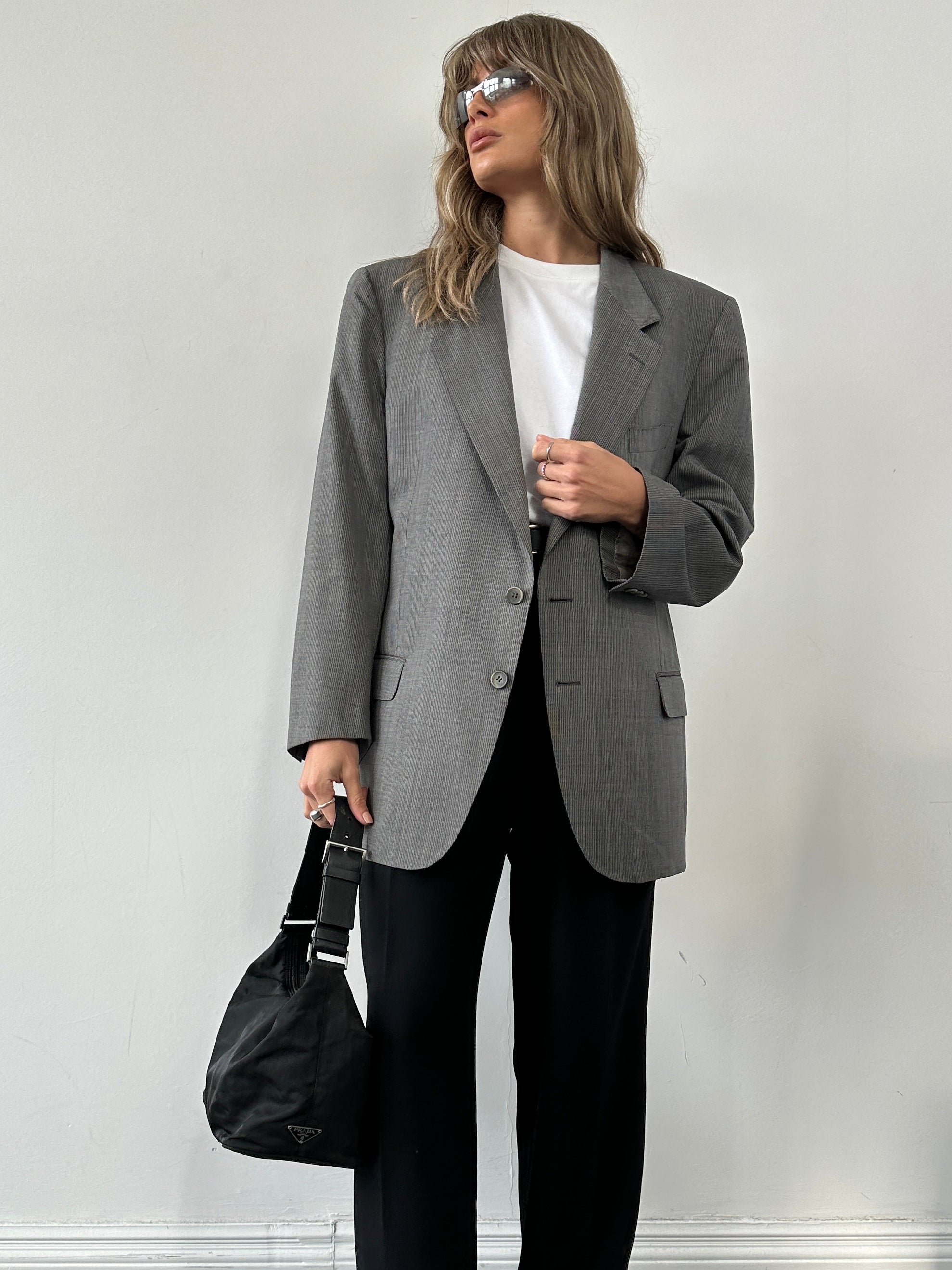Valentino UOMO single-breasted pinstripe blazer in size L/XL, tailored fit with classic lapel and pinstripe pattern on fine fabric.