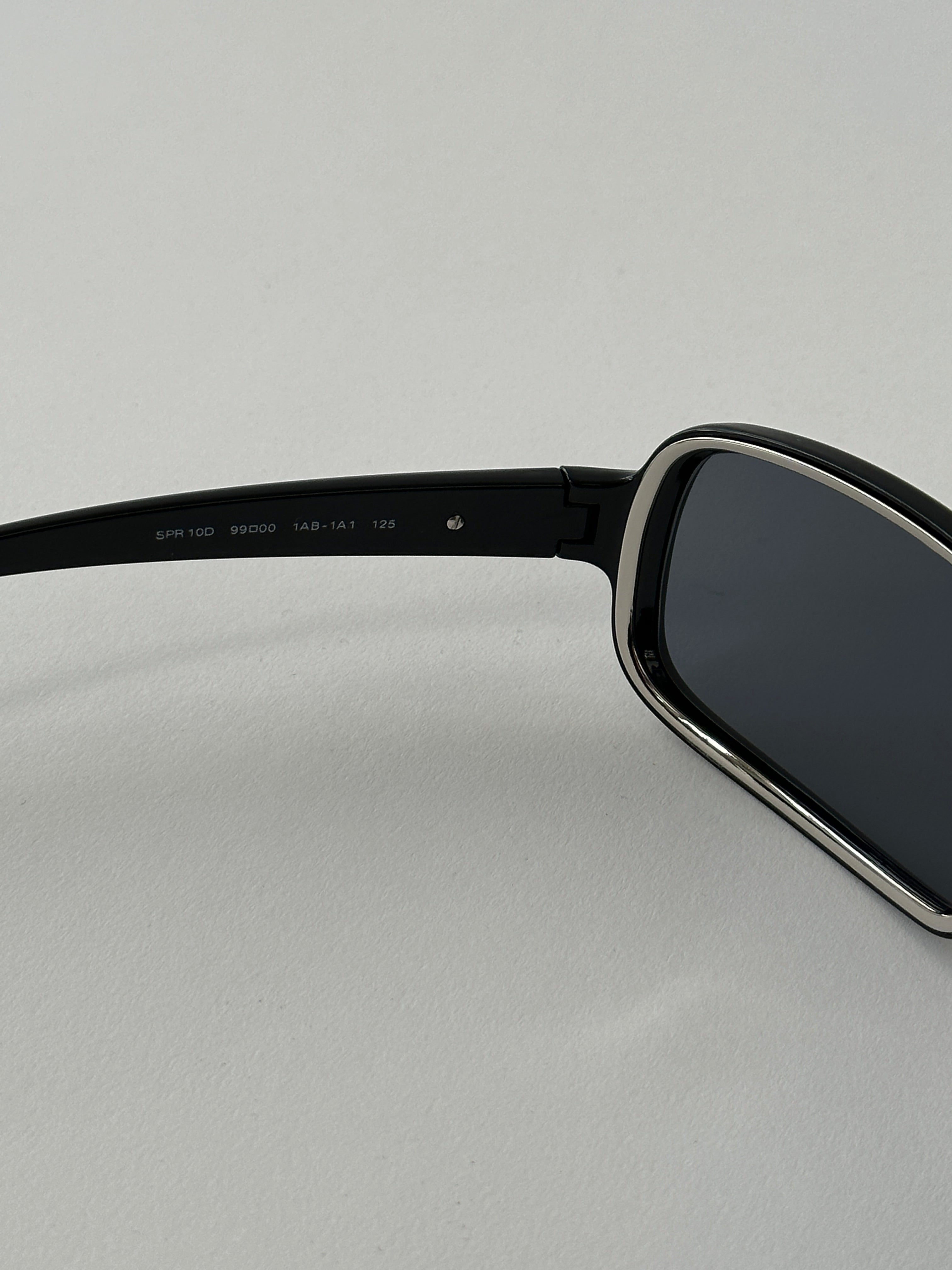Prada 2000s shield sunglasses with dark tinted lenses and bold black frames, stylish and iconic eyewear for a modern look.