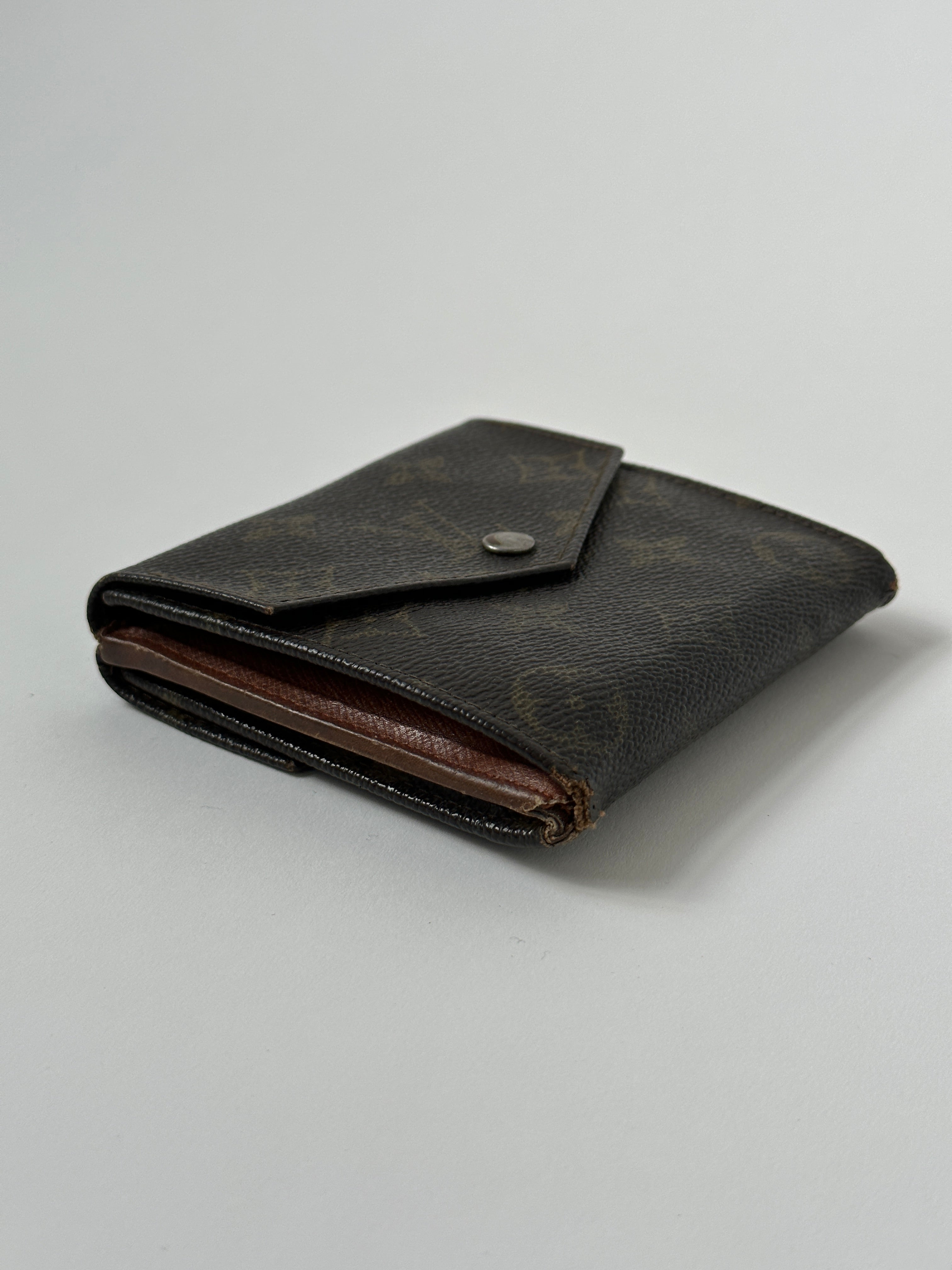 Louis Vuitton 1988 Monogram Wallet, classic leather wallet with monogram pattern and gold-tone hardware, displayed open showing card slots