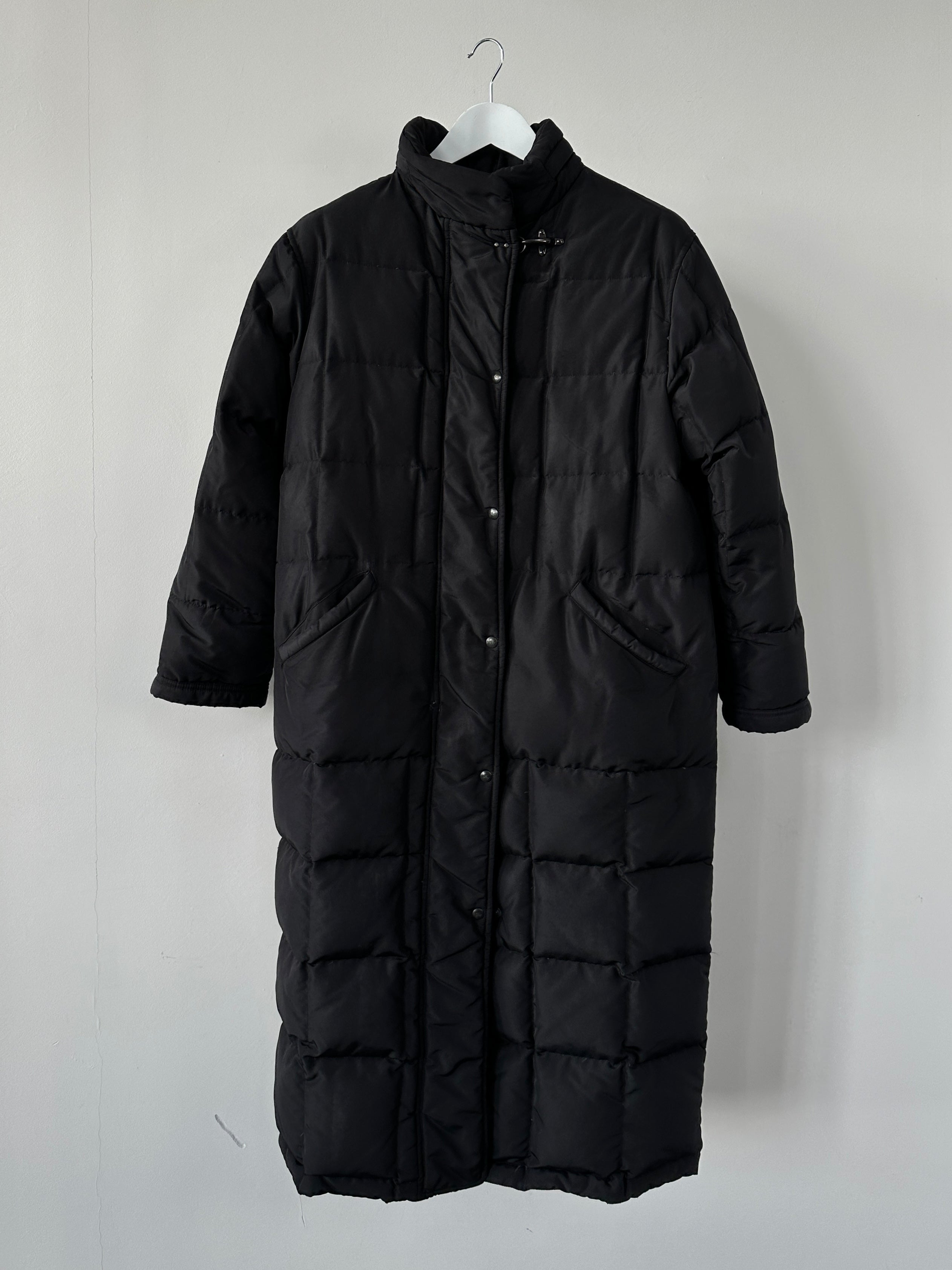 Fay floor length down puffer coat in black, stylish warm winter coat with hood, front zipper, and quilted design.