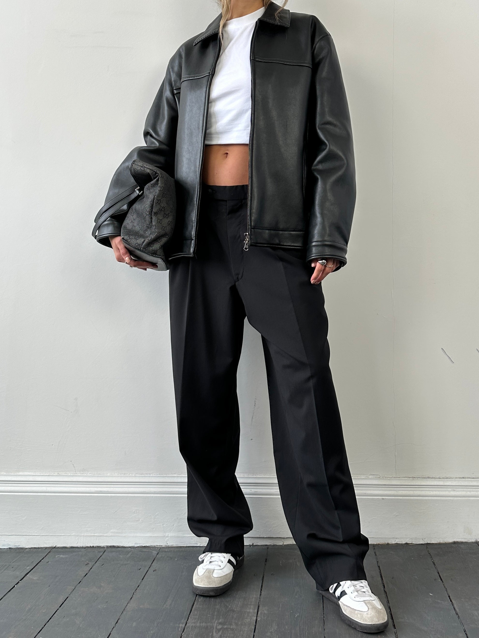 Vintage double zip faux leather jacket in M/L size, featuring classic design and stylish detailing.