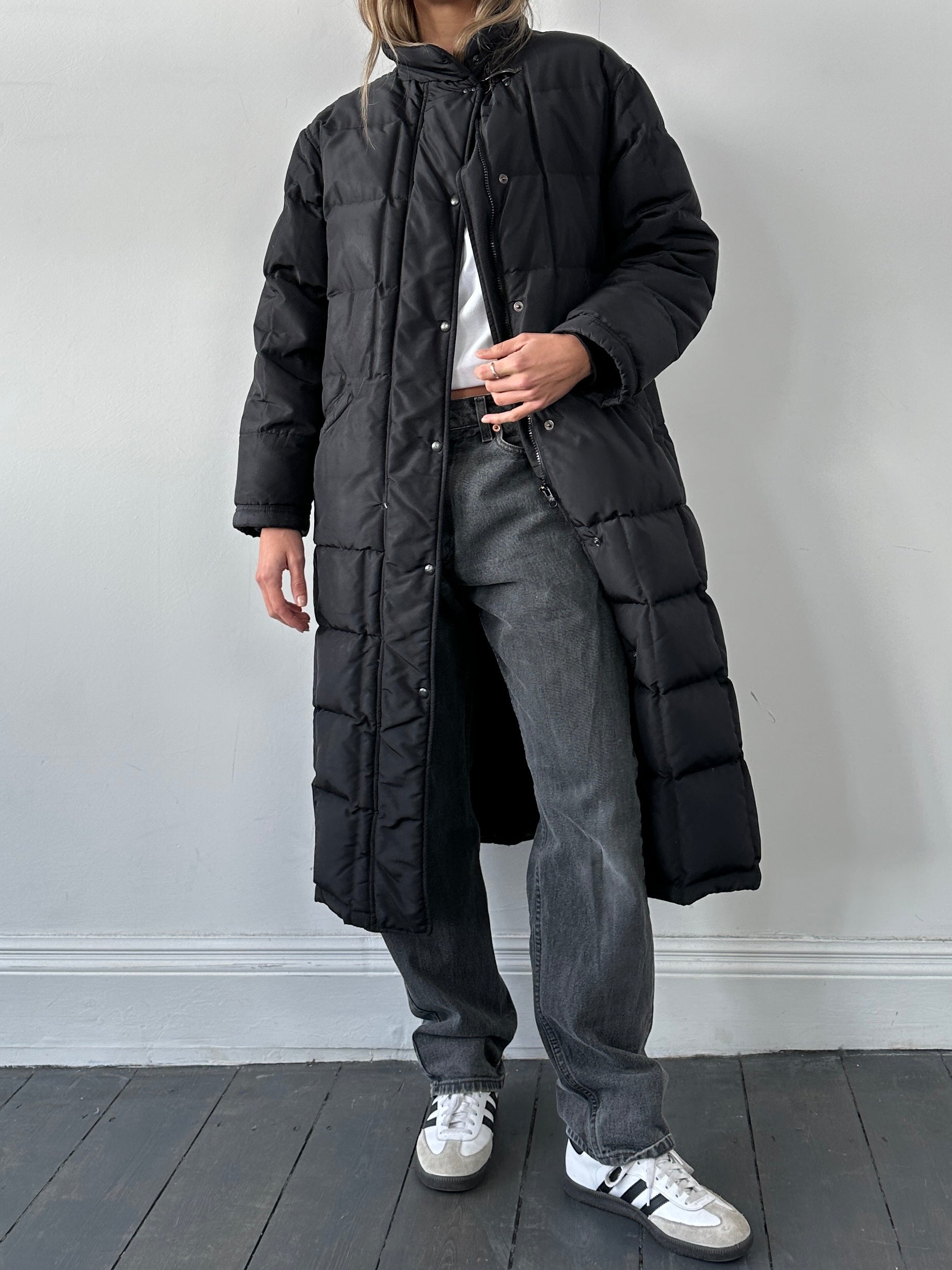 Fay floor length down puffer coat in black, mid-length design with quilted pattern and hood, suitable for cold weather.