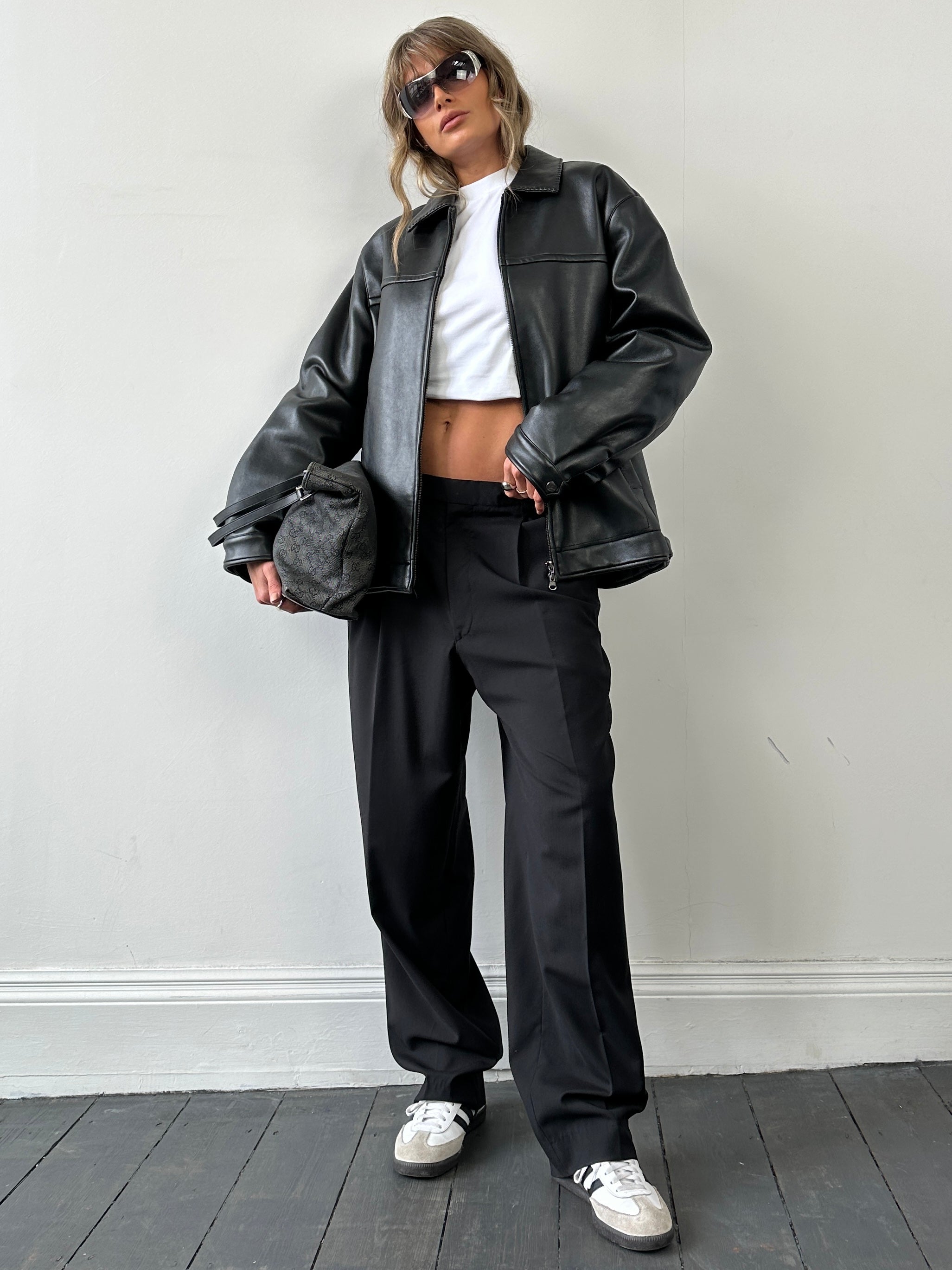 Vintage double zip faux leather jacket in black, featuring a stylish M/L fit with classic design details.